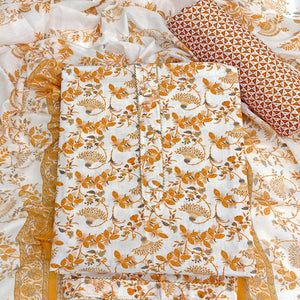 Elegant Mustard Floral Printed Pure Cotton Dress Material With Tie Neck & Fancy Button