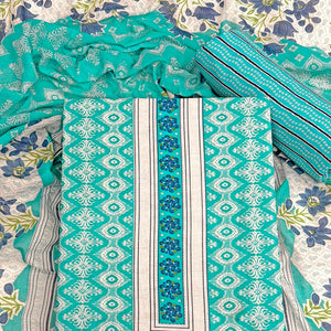 Charming Turquoise Pure Cotton Dress Material With Delicate Floral Print