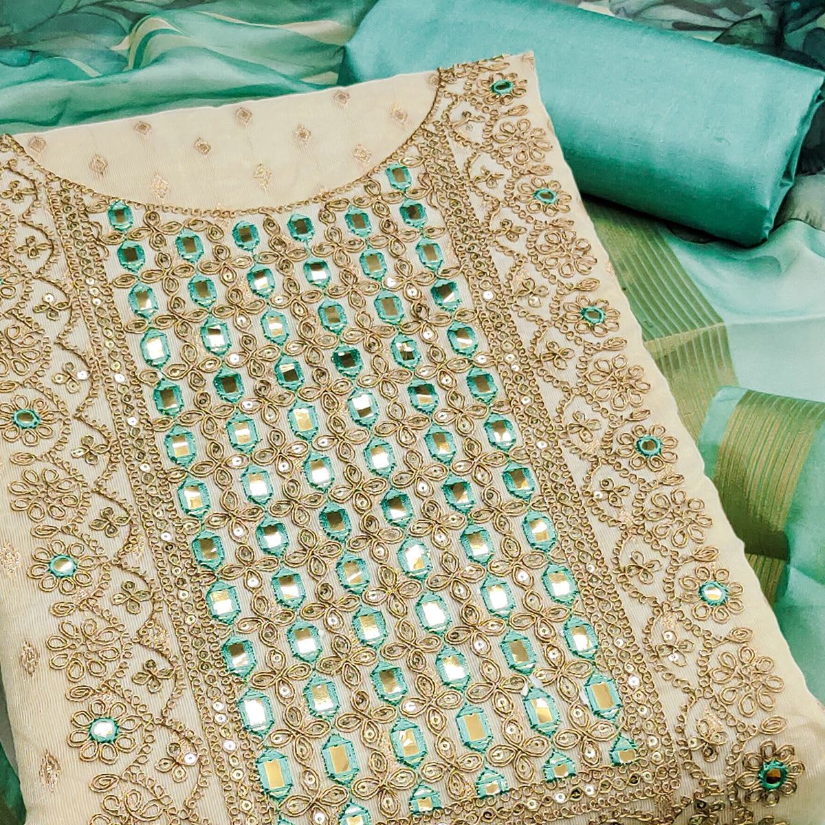 Cream & Turquoise Shimmer Dress Material Featuring Butti Weaving With Sequins Cording Embroidery