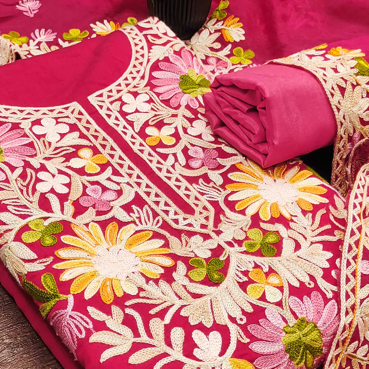 Rani Pink Designer Roman Art Silk Dress Material Adorned With Floral Thread Embroidery Work