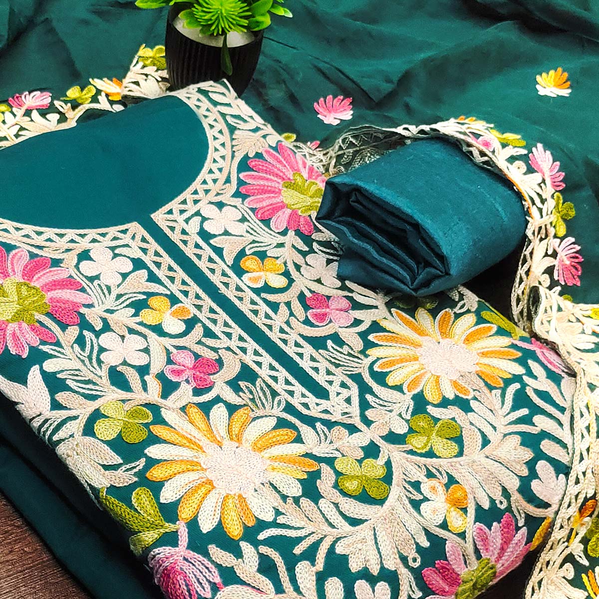 Teal Designer Roman Art Silk Dress Material Adorned With Floral Thread Embroidery Work