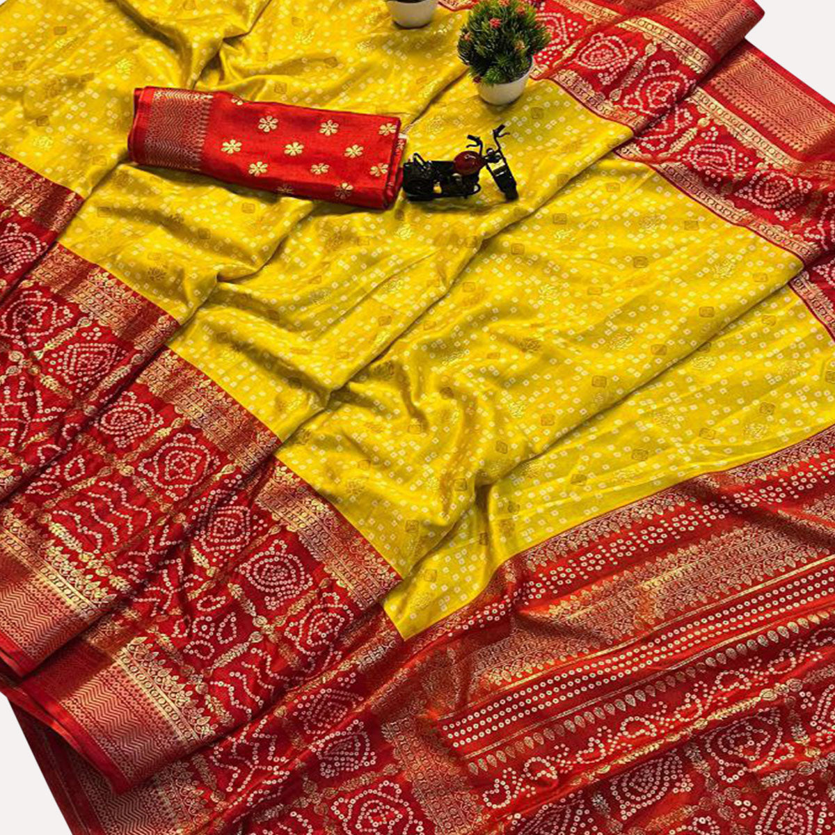 Yellow & Red Dola Silk Saree Featuring Traditional Bandhani Print & Woven Border