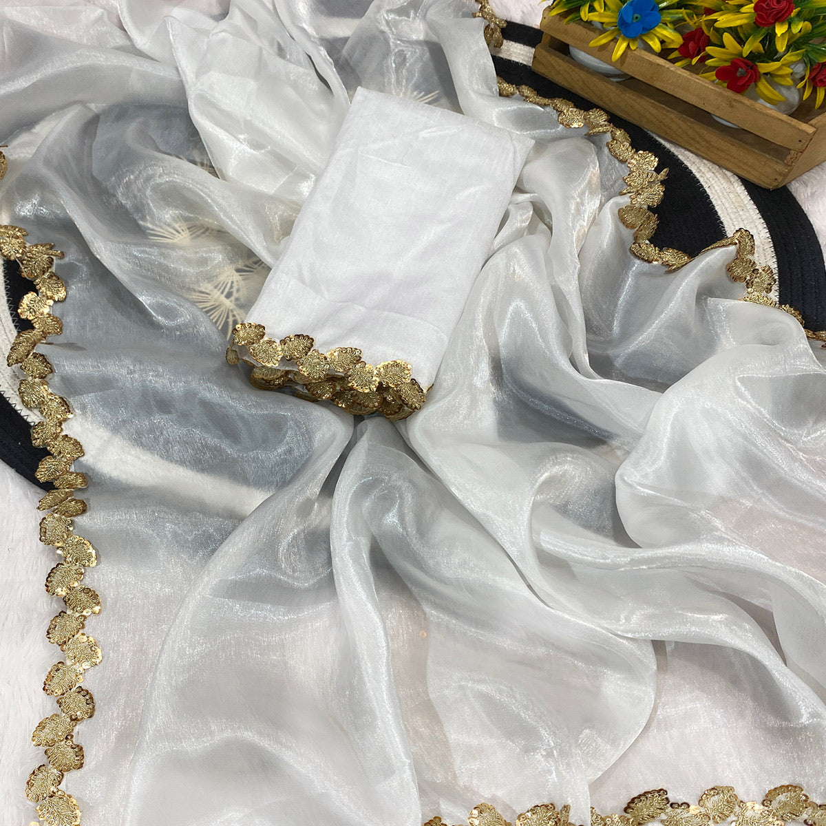 White Tissue Saree Featuring Solid Finish and Delicate Lace Work by Jimmy Choo Style