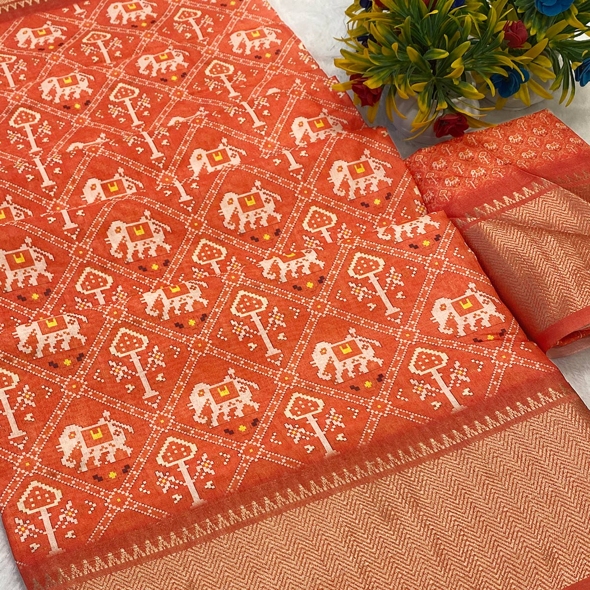 Orange Dola Silk Saree Featuring Traditional Patan Patola Print