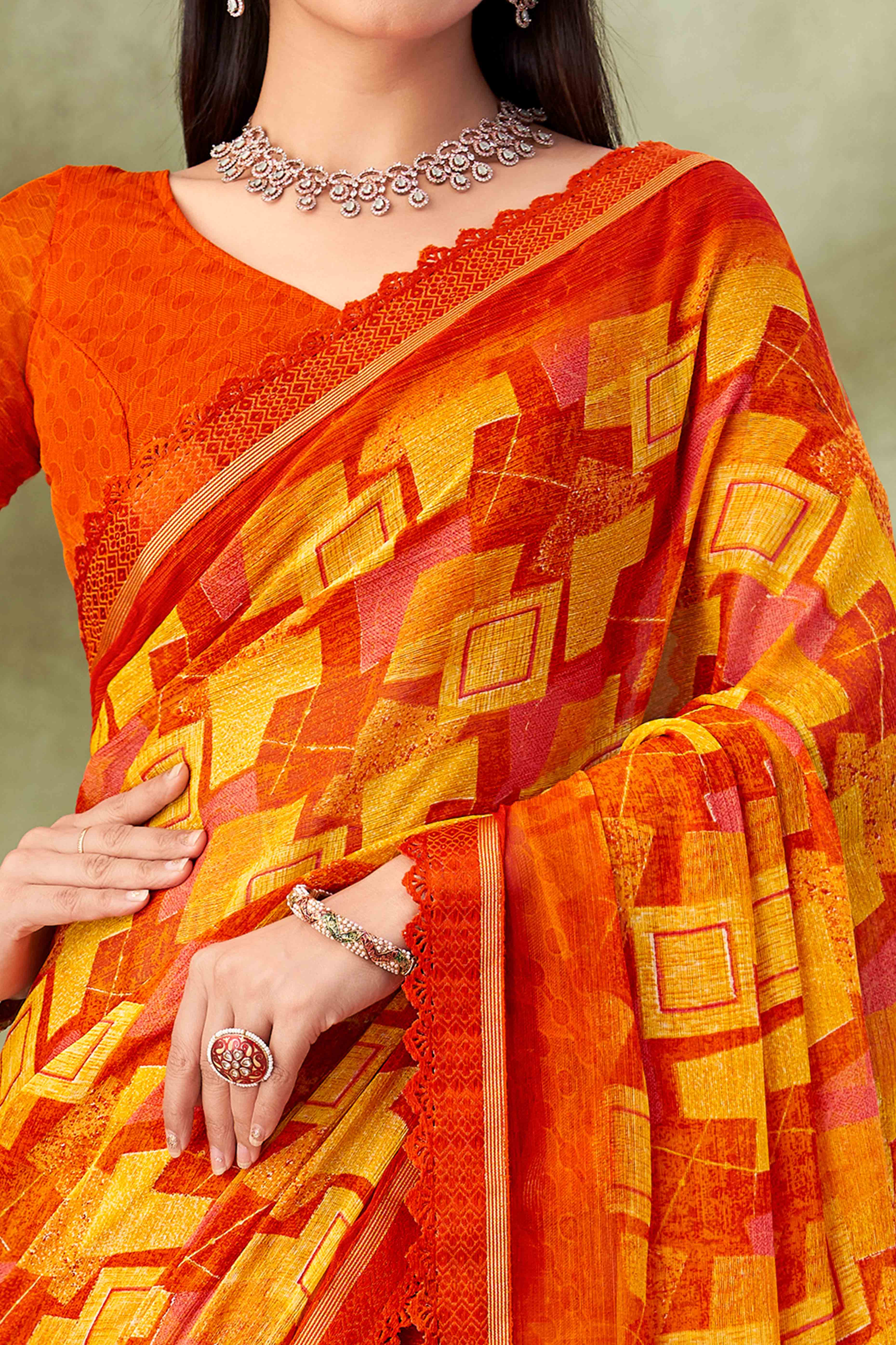 Orange Digital Printed Chiffon Saree Accented With Elegant Lace Border