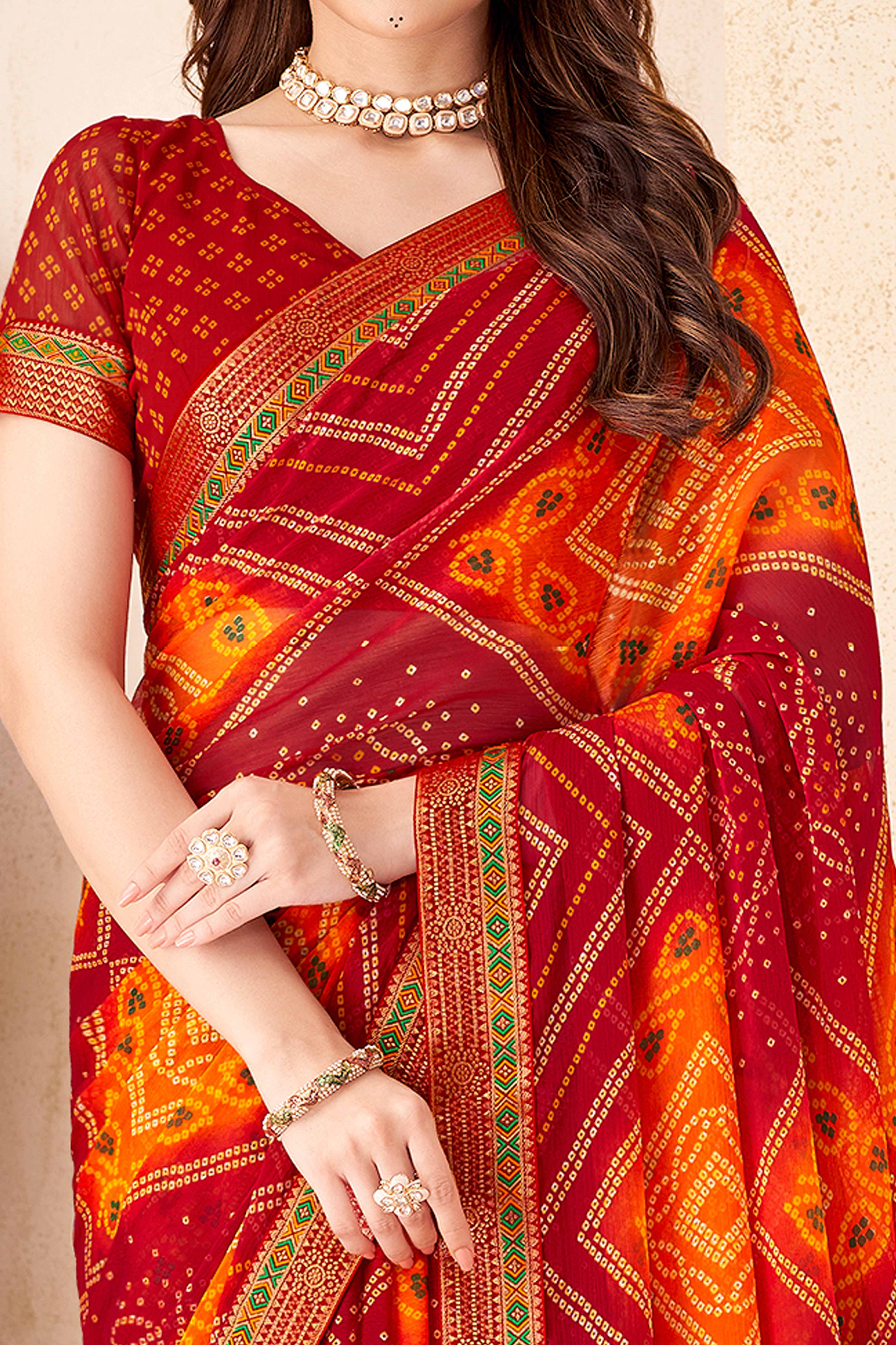 Maroon & Orange Bandhani Printed Chiffon Saree Enhanced with Delicate Lace Border Work