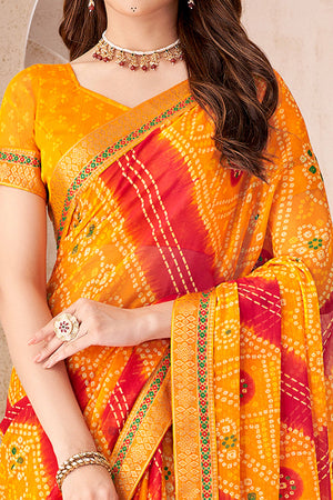 Bright Orange Bandhani Printed Chiffon Saree Enhanced with Delicate Lace Border Work