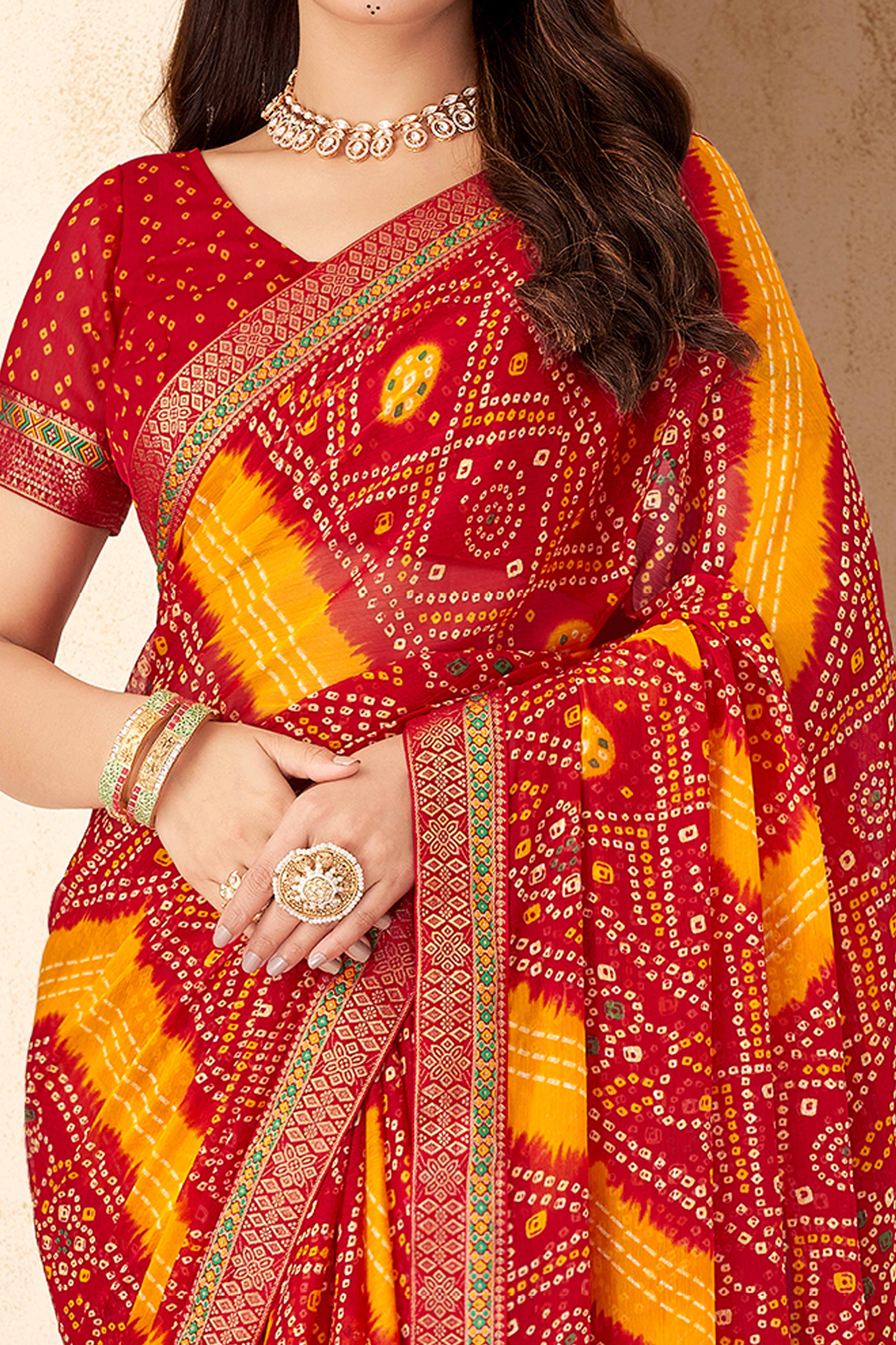 Red & Mustard Bandhani Printed Chiffon Saree Enhanced with Delicate Lace Border Work