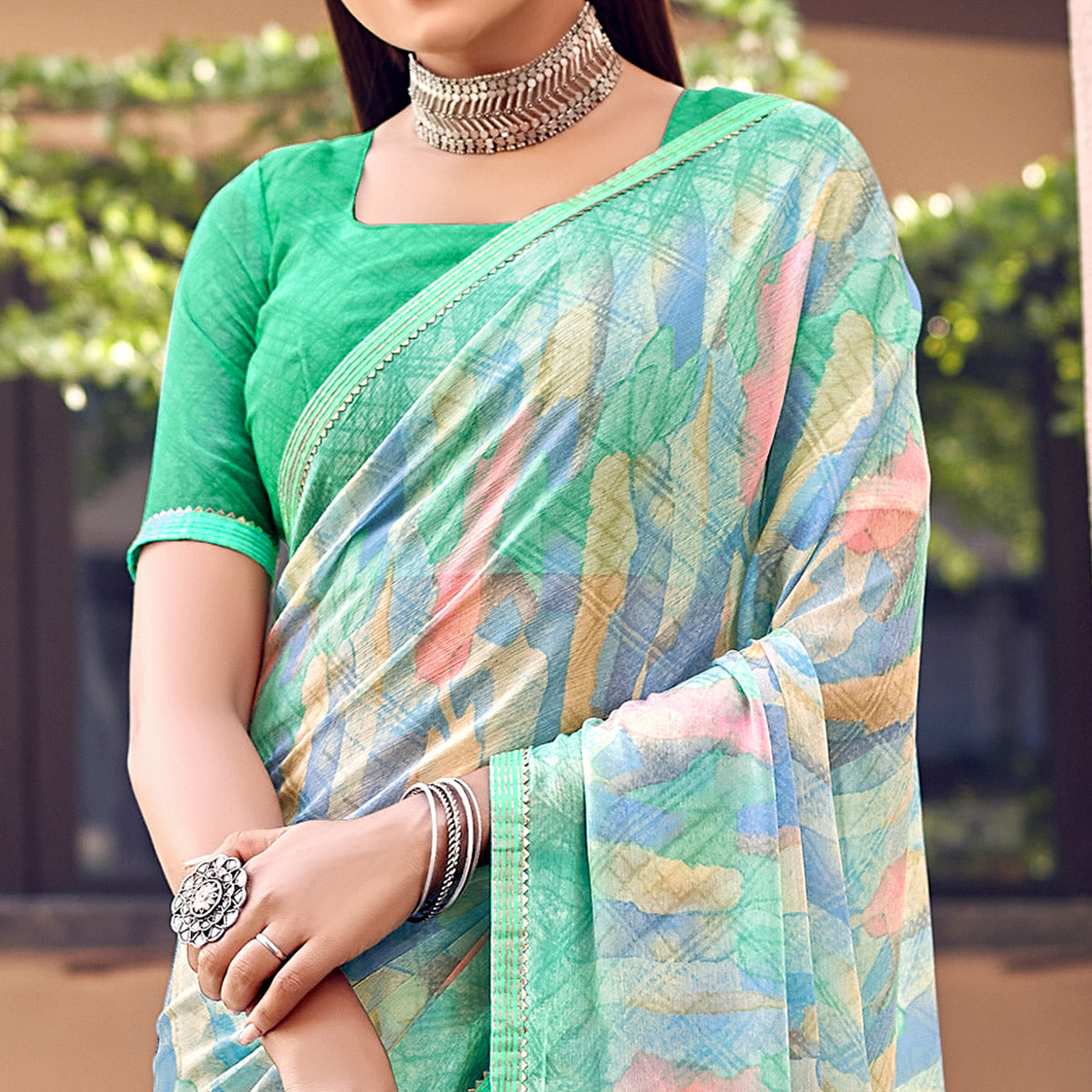 Turquoise Printed Chiffon Saree With Tassels