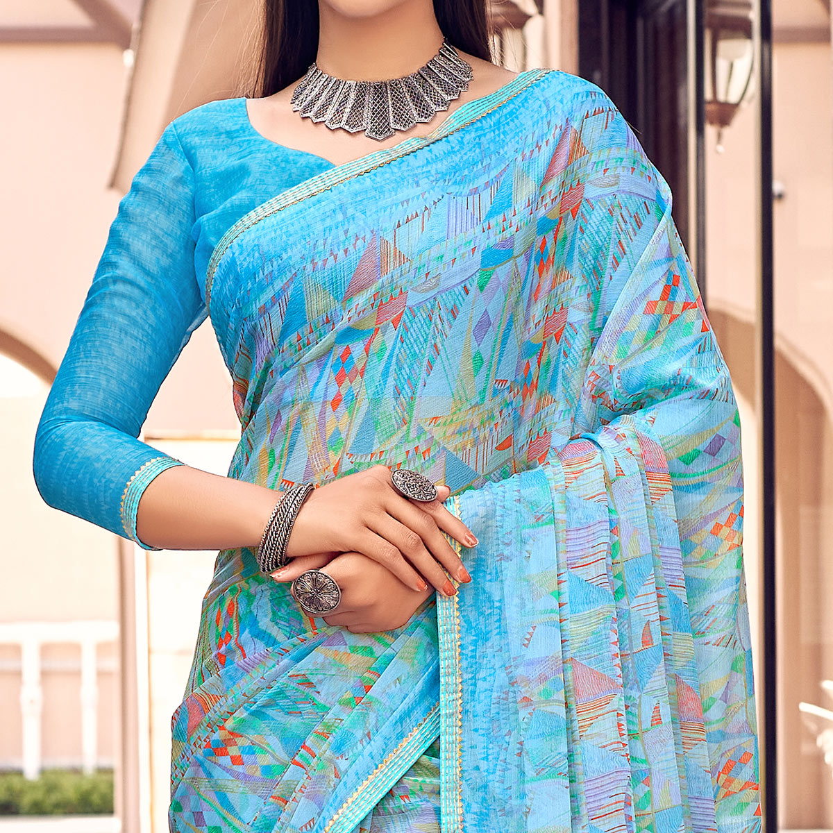 Blue Printed Chiffon Saree With Tassels