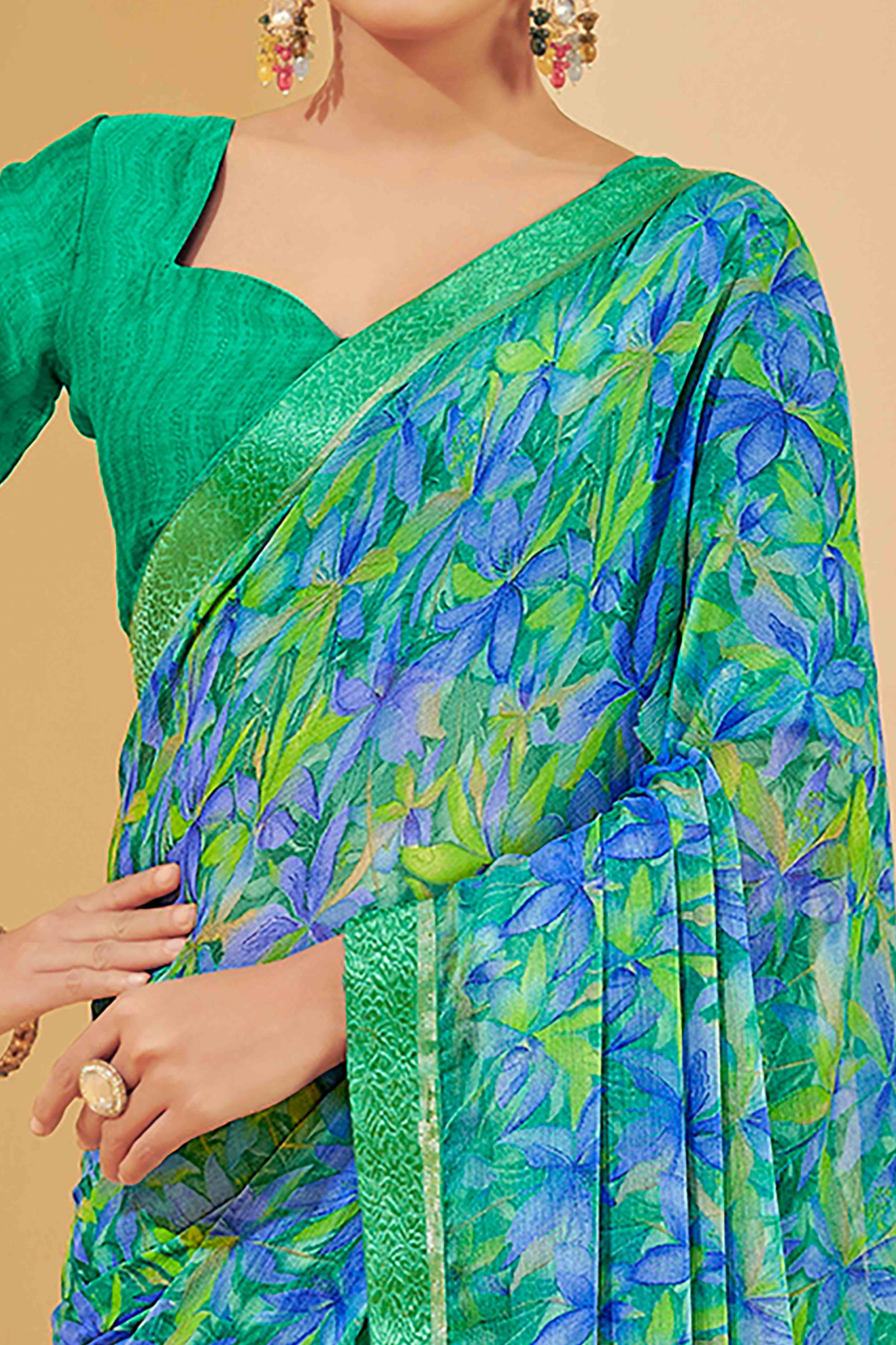Green & Blue Chiffon Saree Adorned With Artistic Floral Print & Finely Crafted Woven Lace Border