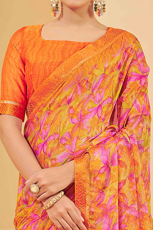 Orange Chiffon Saree Adorned With Artistic Floral Print & Finely Crafted Woven Lace Border