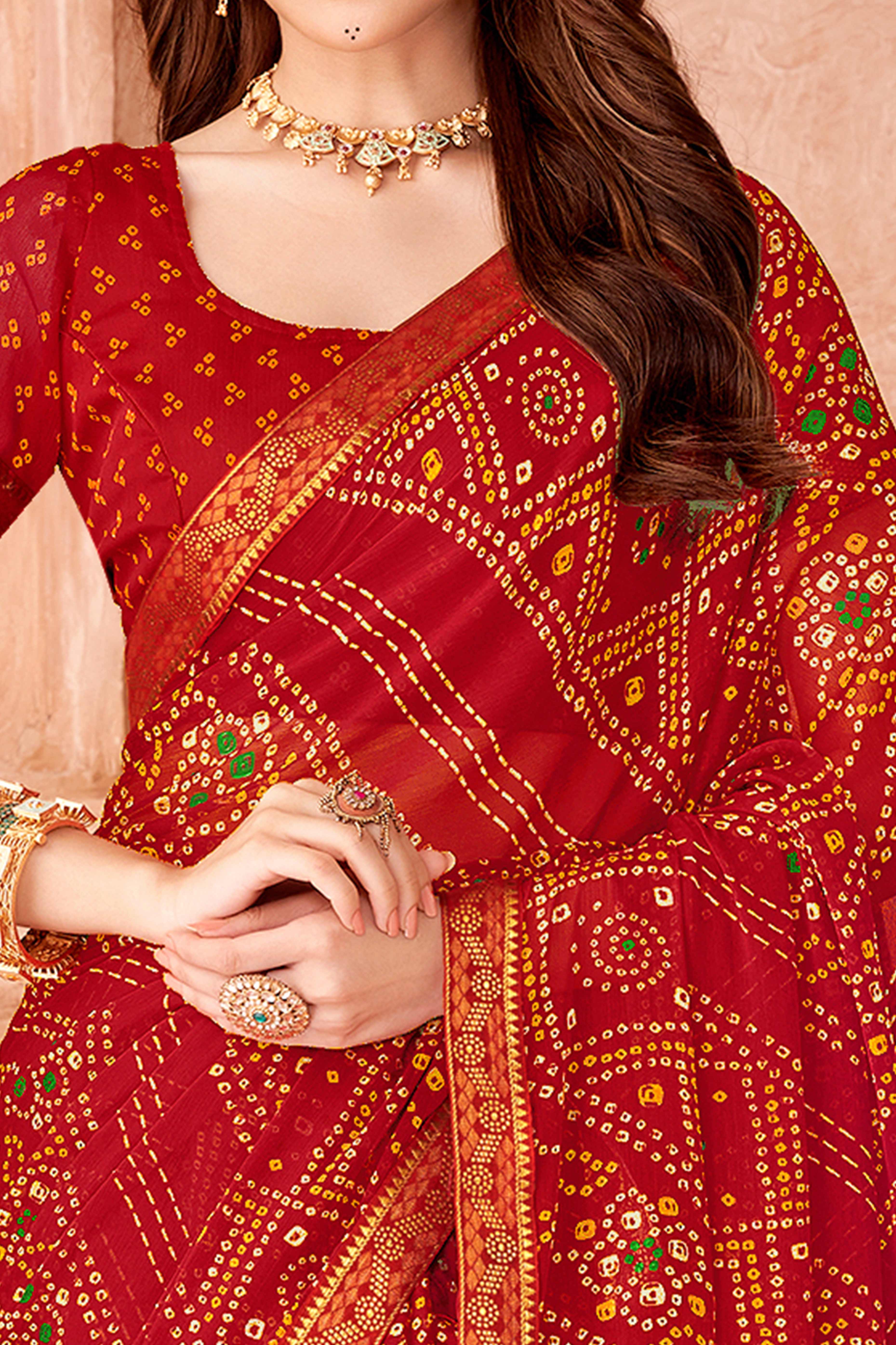 Red Chiffon Saree Featuring Traditional Bandhani Prints & A Graceful Lace Edge