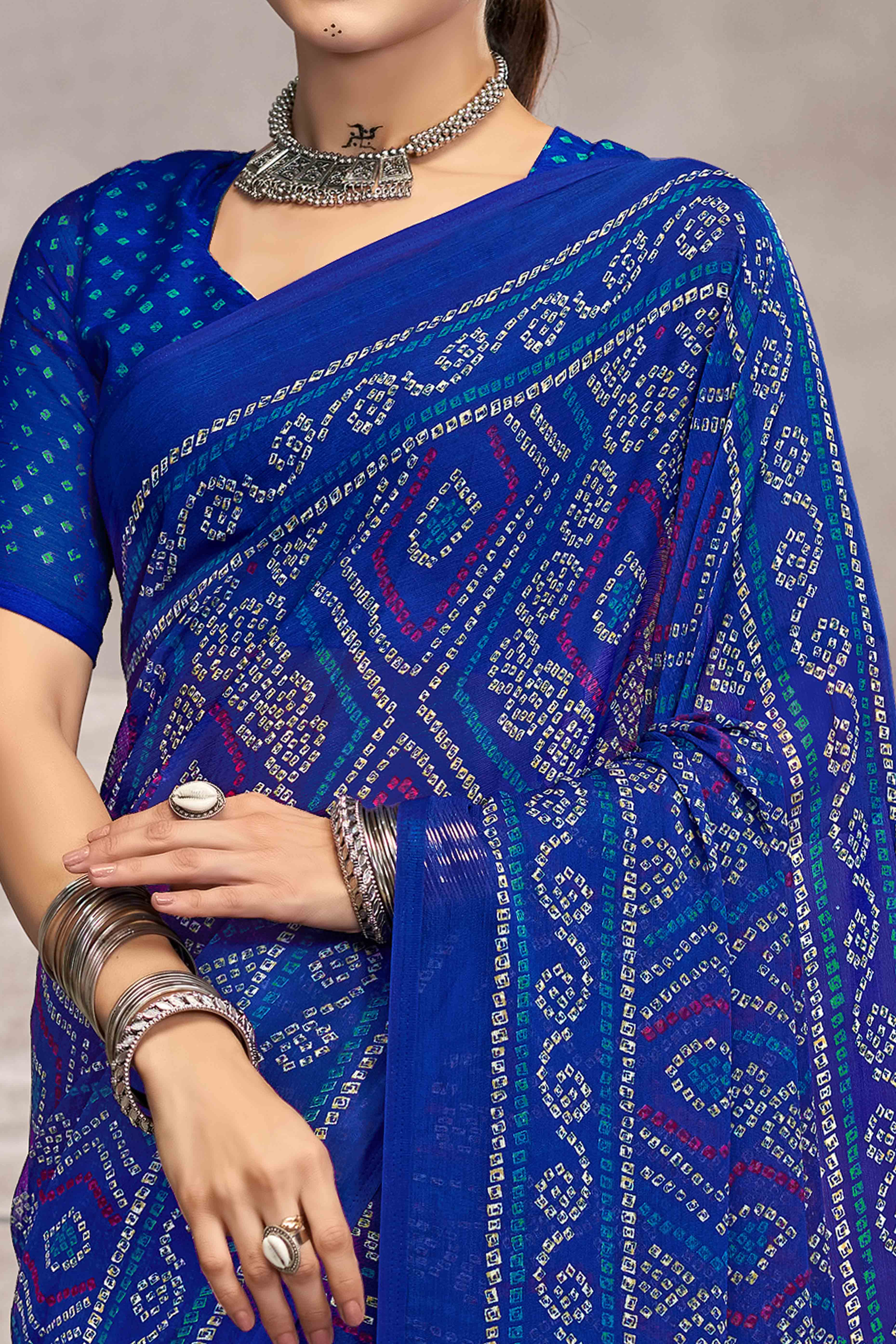 Blue Chiffon Saree Features Bandhani Print for Casual Occasion