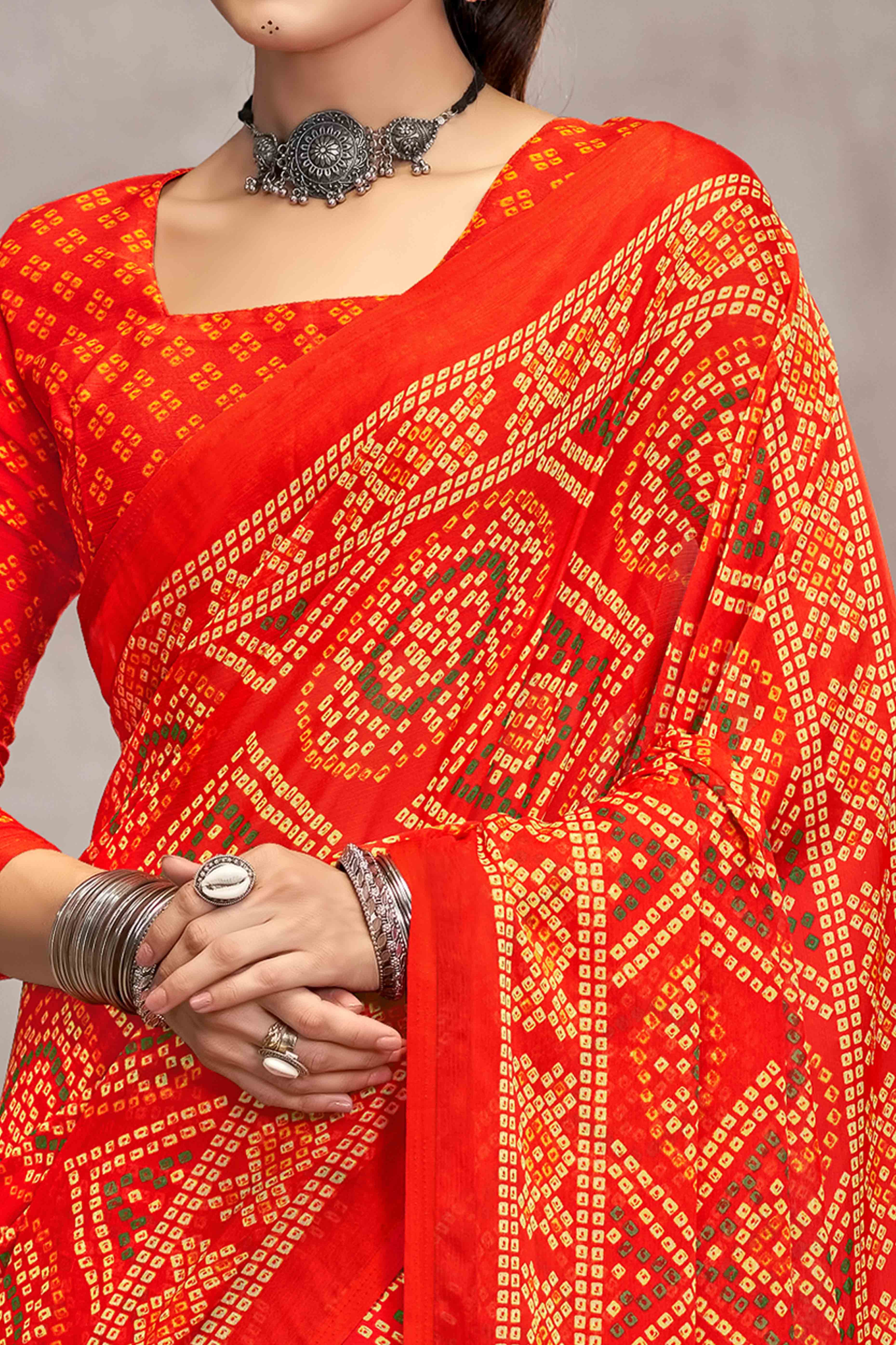 Orange Chiffon Saree Features Bandhani Print for Casual Occasion