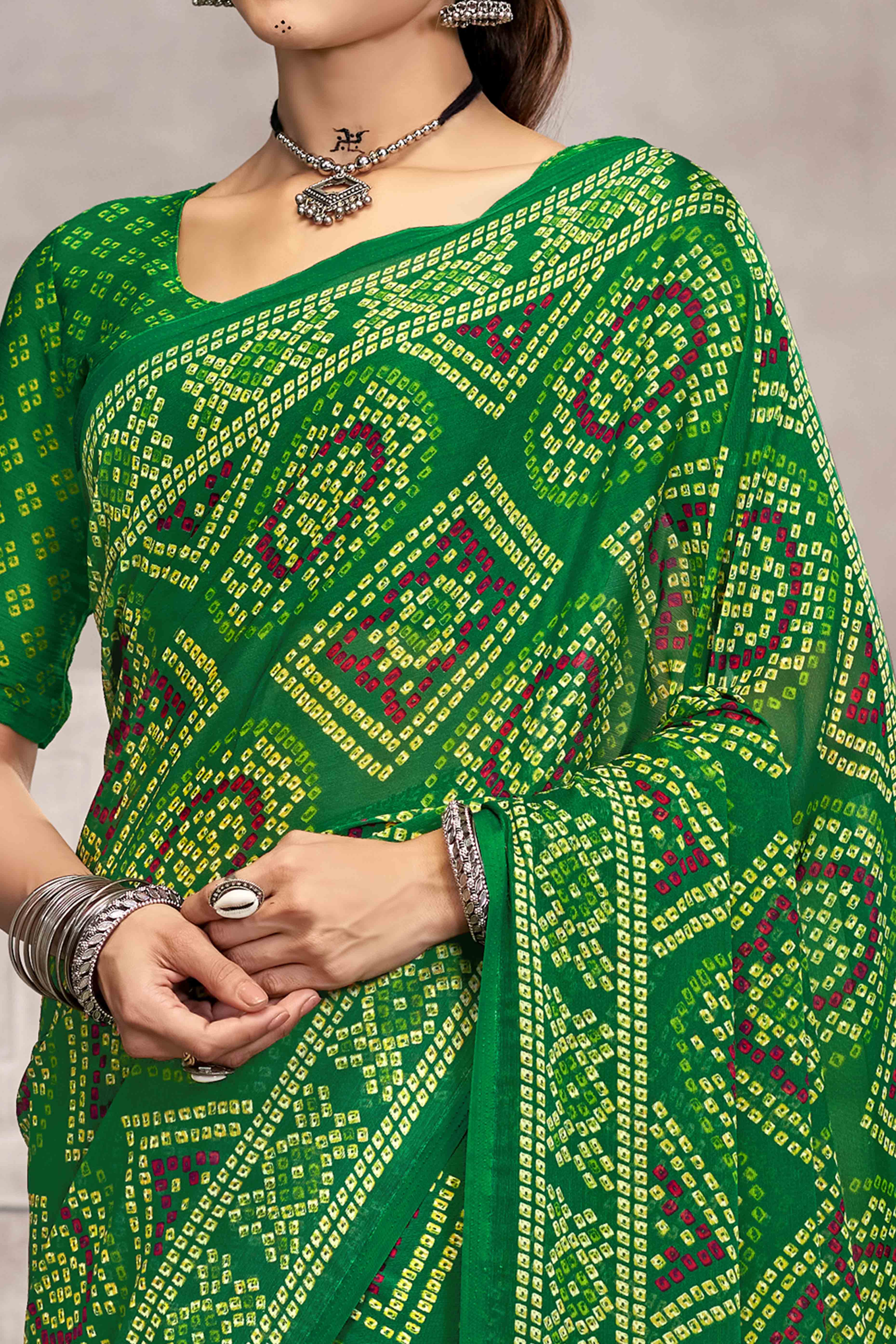 Green Chiffon Saree Features Bandhani Print for Casual Occasion