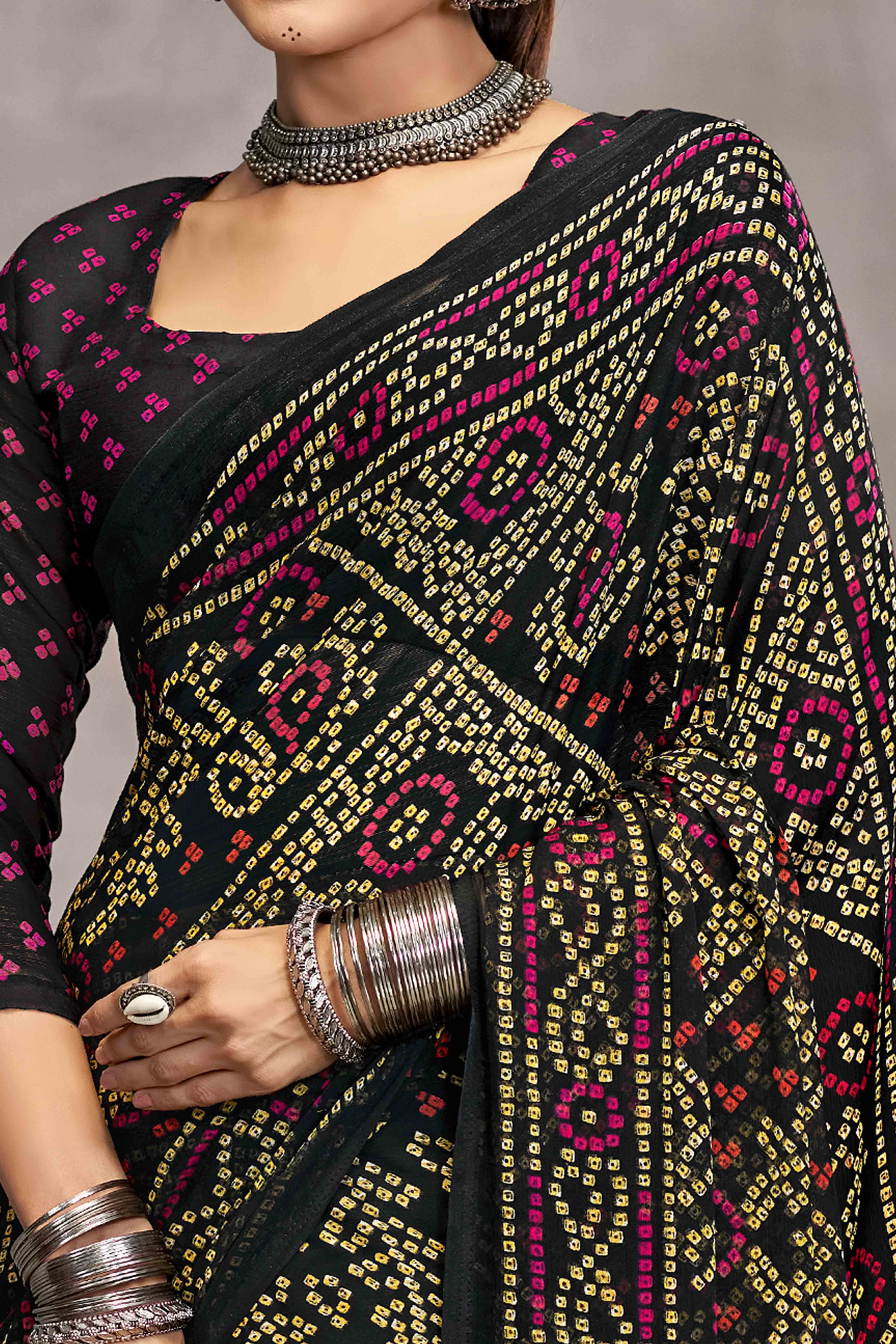 Black Chiffon Saree Features Bandhani Print for Casual Occasion