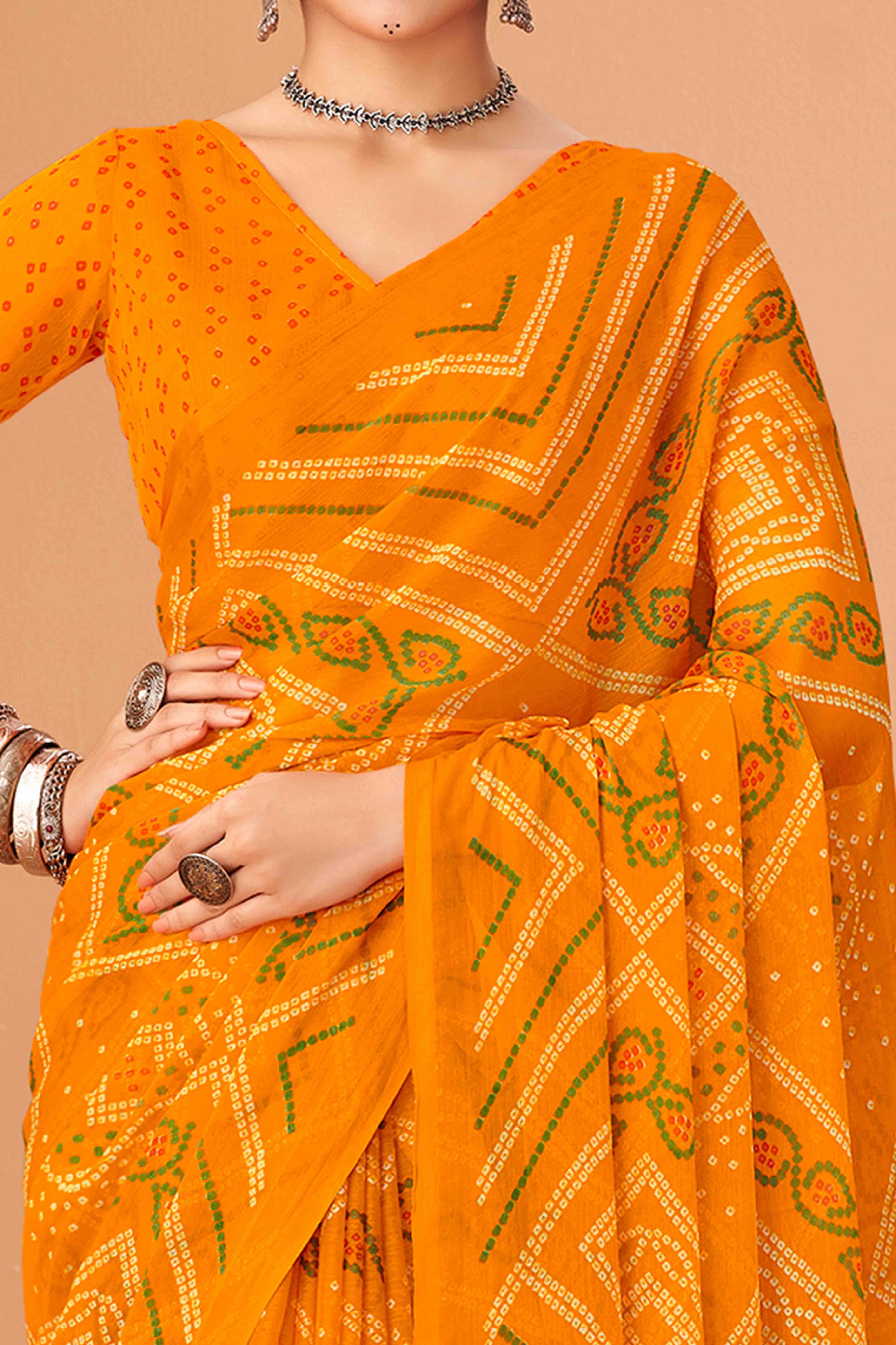 Mustard Bandhani Printed Chiffon Saree Accented With Intricate Lace Border Work