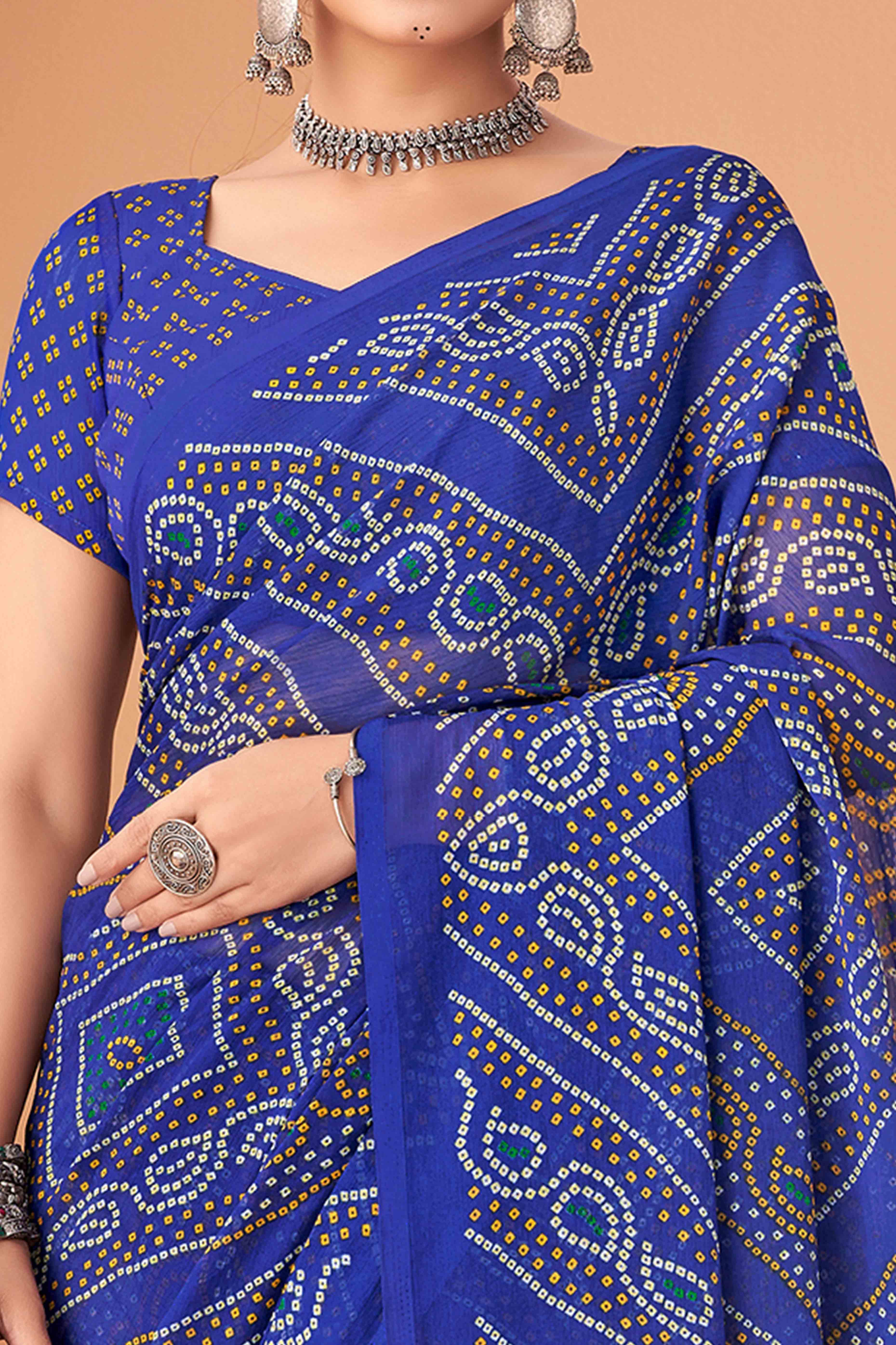Blue Bandhani Printed Chiffon Saree Accented With Intricate Lace Border Work