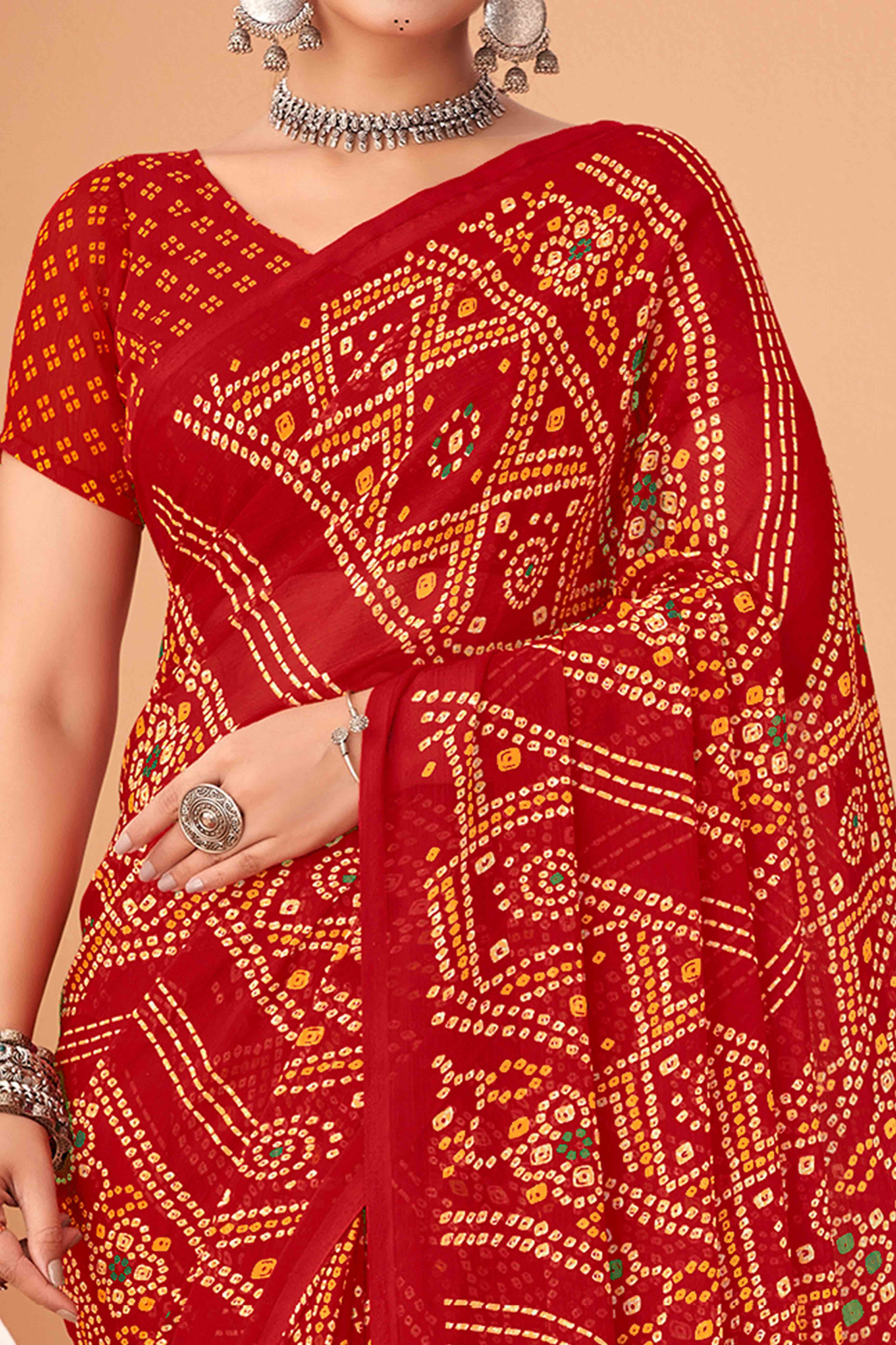 Red Bandhani Printed Chiffon Saree Accented With Intricate Lace Border Work