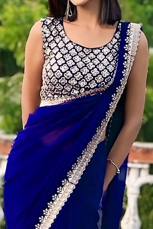 Blue Georgette Saree With Sleek Solid Finish And Embroidered Edging