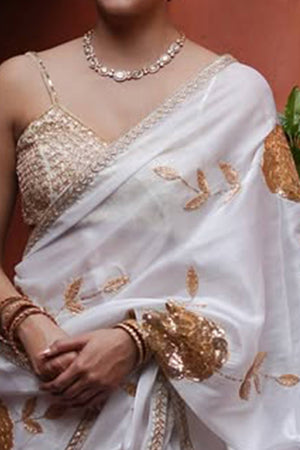 White Silk Blend Saree Featuring Delicate Floral Motifs in Shimmering Sequins
