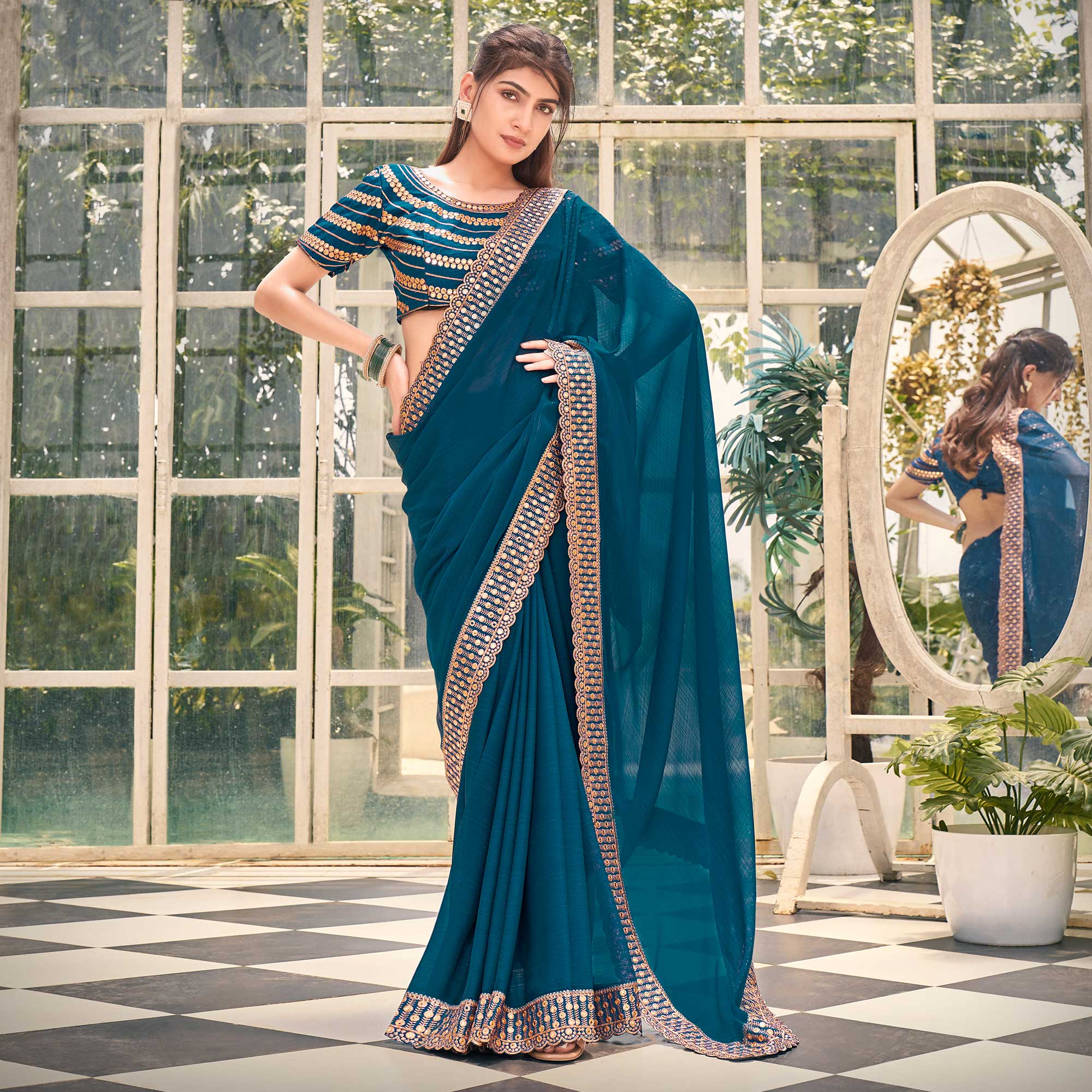 Teal Solid With Embroidered Border Georgette Saree