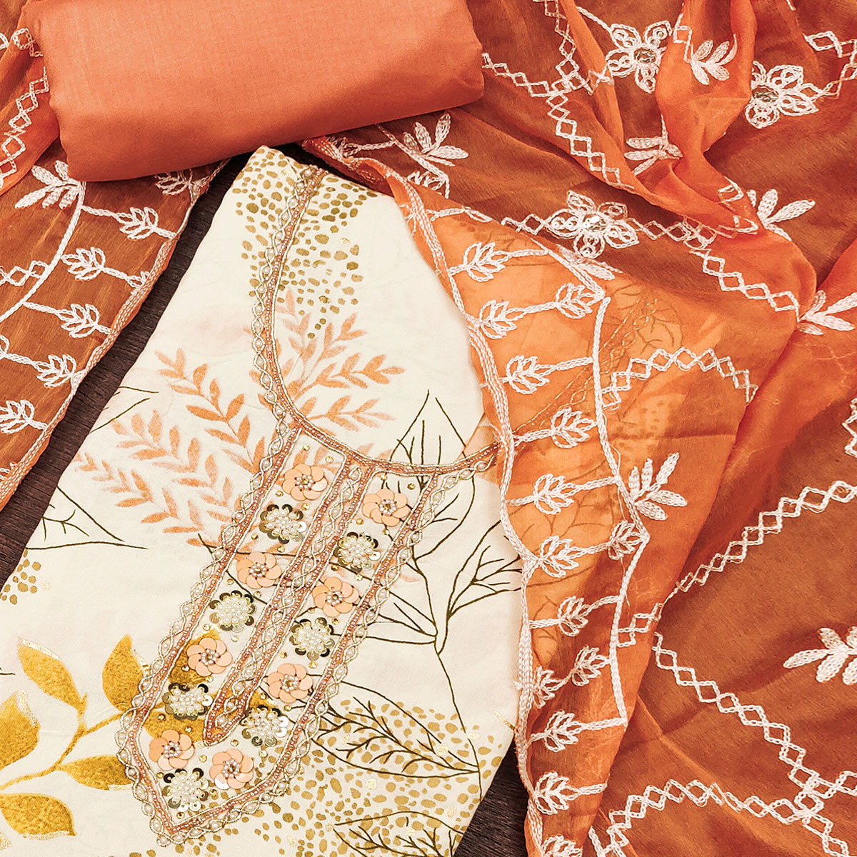Cream & Orange Floral Printed Pure Cotton Dress Material With Intricate Moti & Stones work