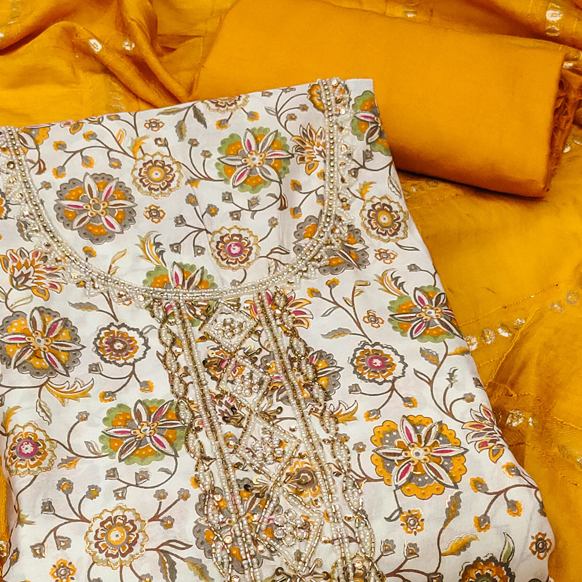 Mustard Floral Printed Roman Cotton Silk Dress Material With Intricate Moti & Sequins Handwork