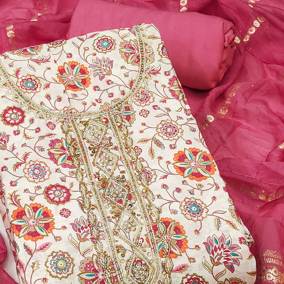 Pink Floral Printed Roman Cotton Silk Dress Material With Intricate Moti & Sequins Handwork