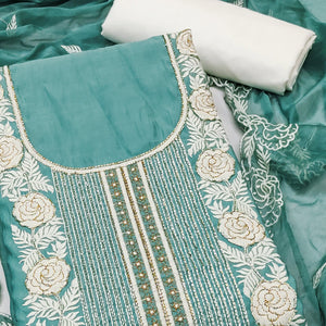 Teal Cotton Silk Dress Material Embellished With Floral Embroidery & Intricate Handwork