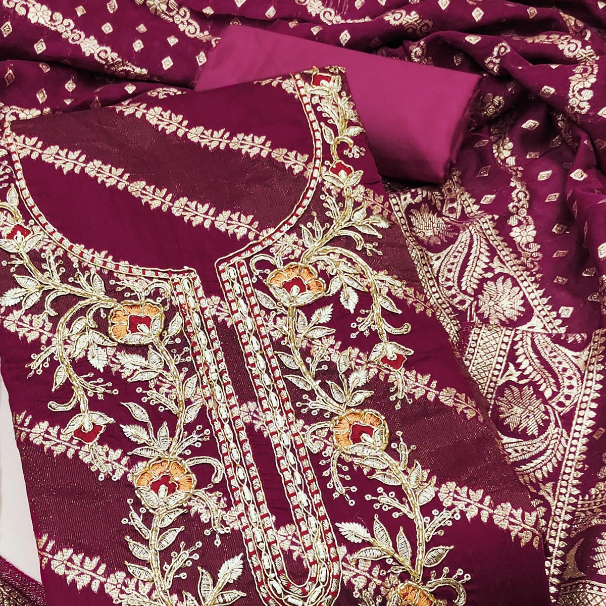 Magenta Shimmer Cotton Silk Suit Material Featuring Zari Weaving and Artistic Embroidered Detailing