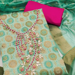 Sophisticated Turquoise Zari Woven Jacquard Dress Material Highlighted With Floral Handwork