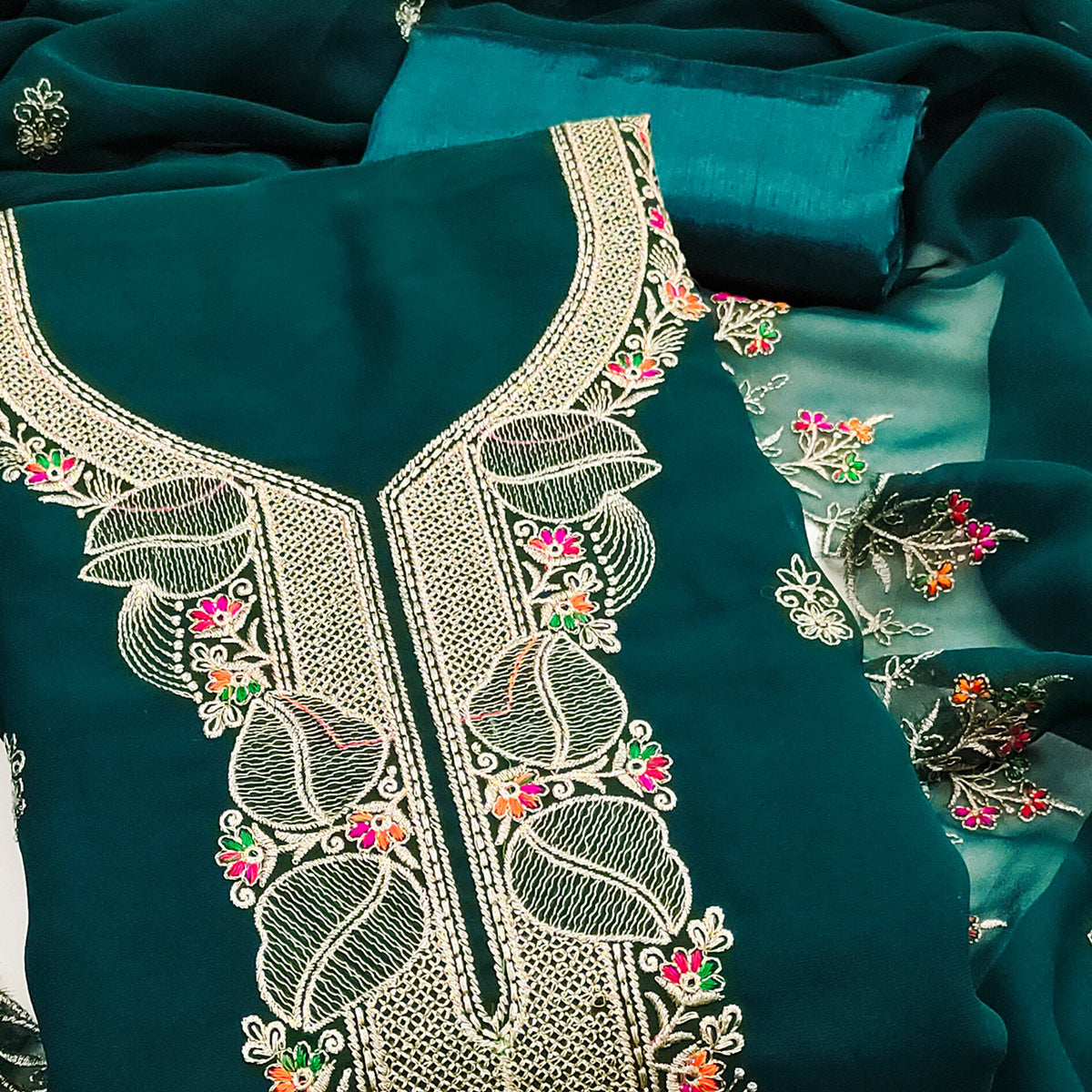 Green Georgette Dress Material Adorned With Floral Embroidery & Elegant Lace Border