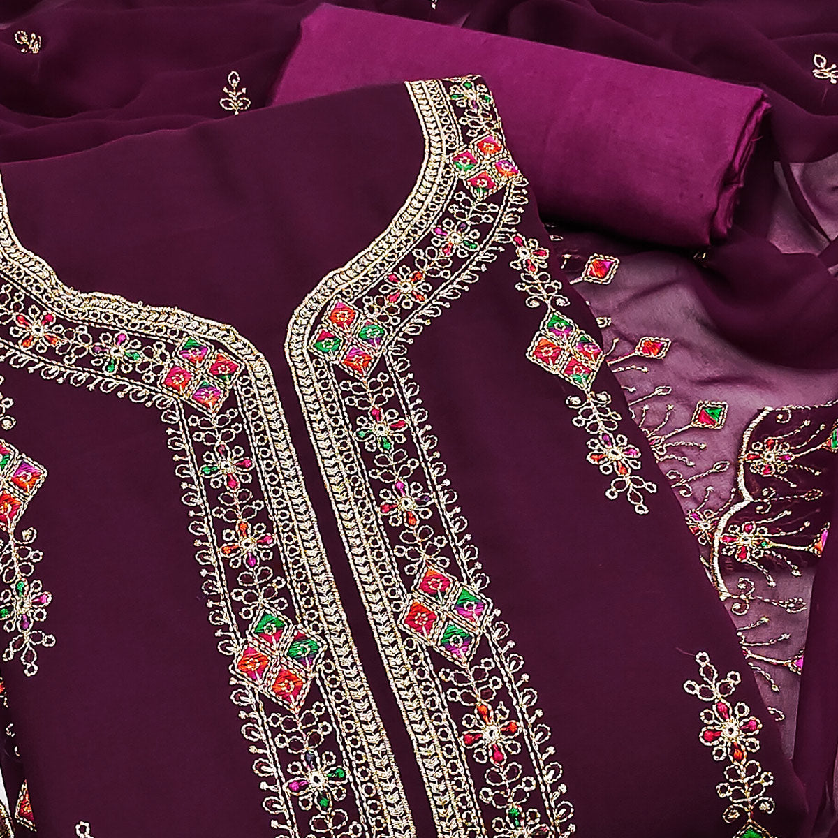 Wine Georgette Dress Material Enhanced With Graceful Floral Embroidery For An Elegant Ethnic Look