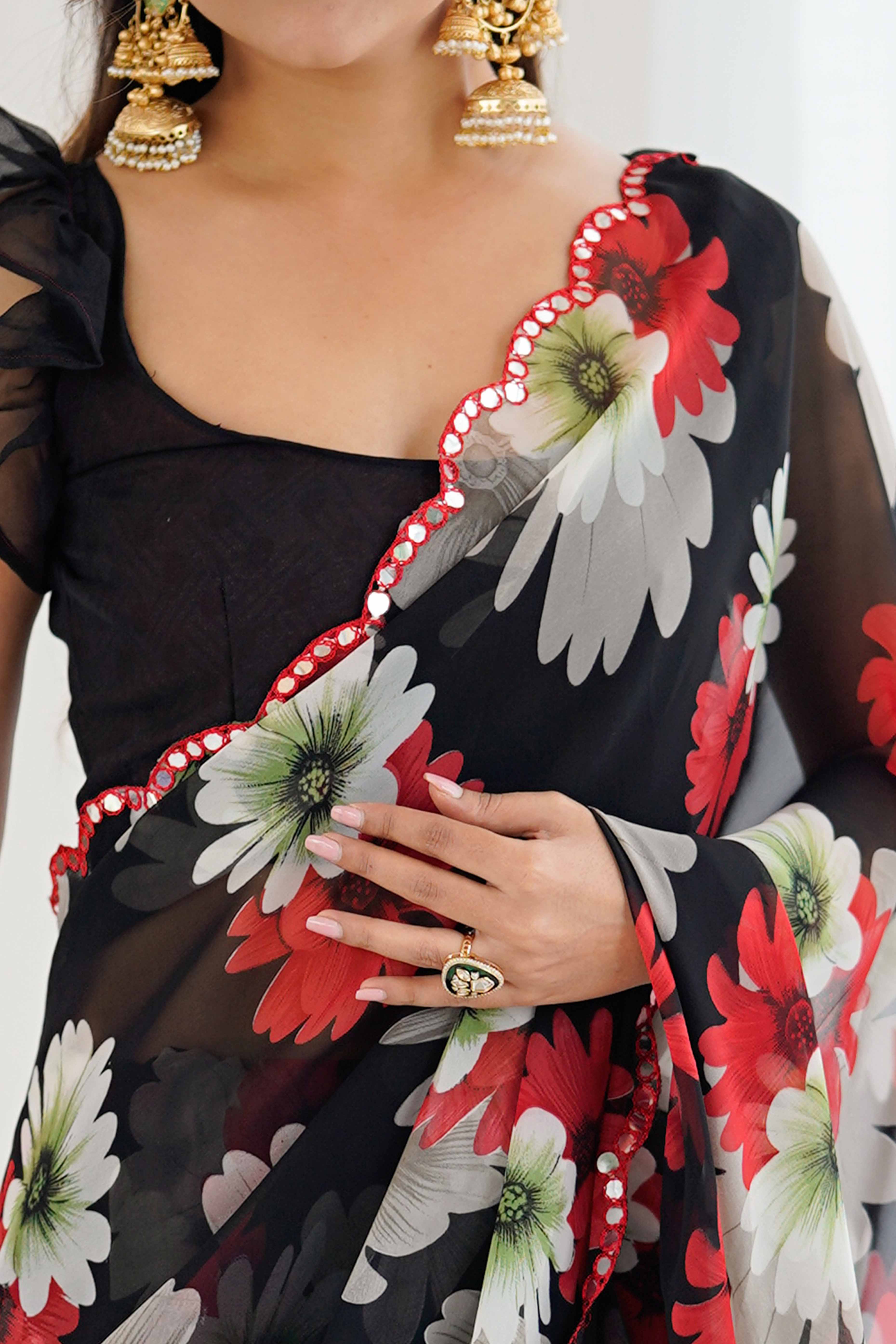 Black Georgette Saree Featuring Floral Prints & Shimmering Mirror Work Border