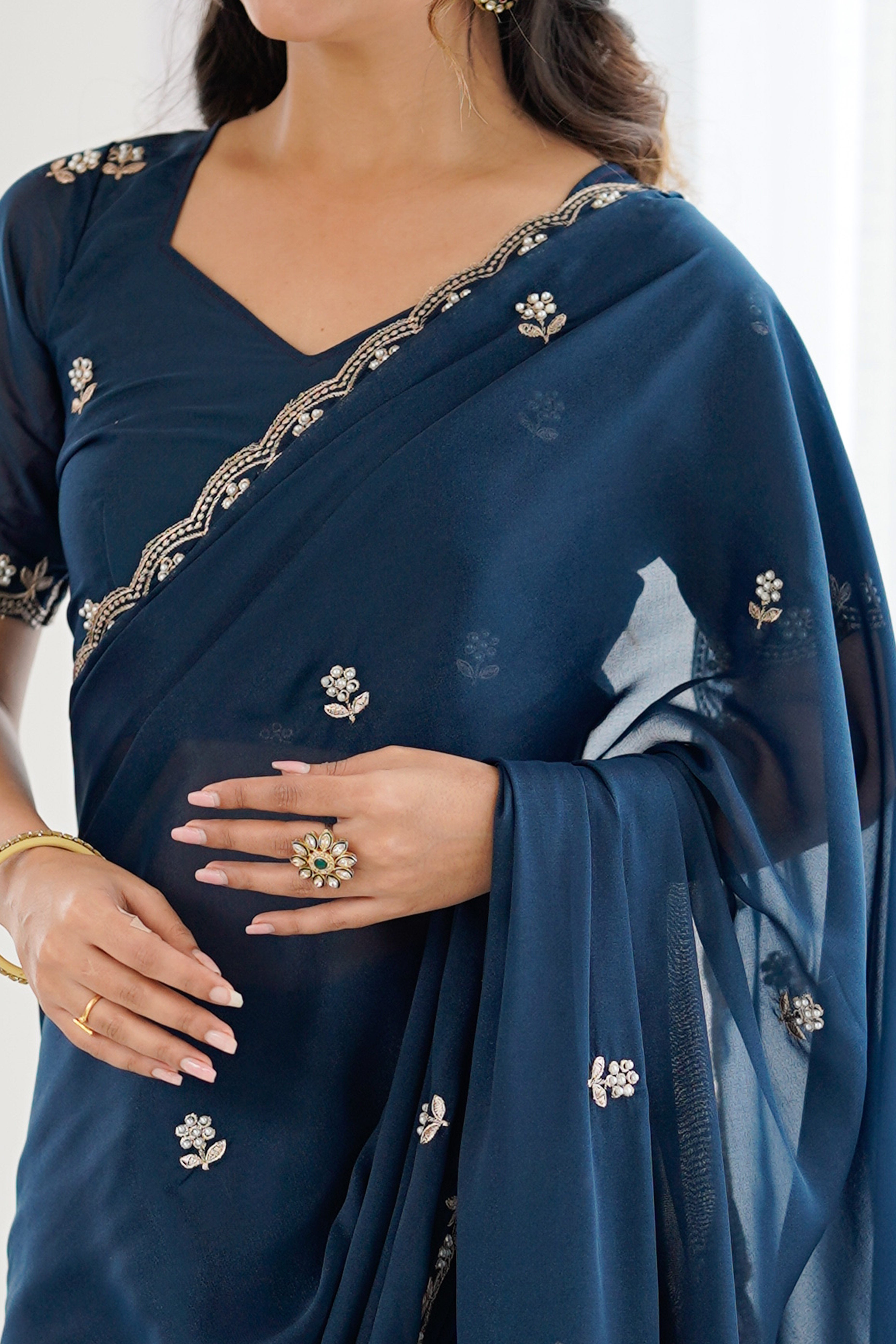 Blue Partywear Star Georgette Saree Adorned with Floral Embroidery and Beads Work