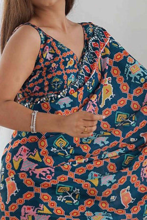 Dark Teal Blue Digital Print Georgette Saree Enhanced With A Sparkling Lace Border