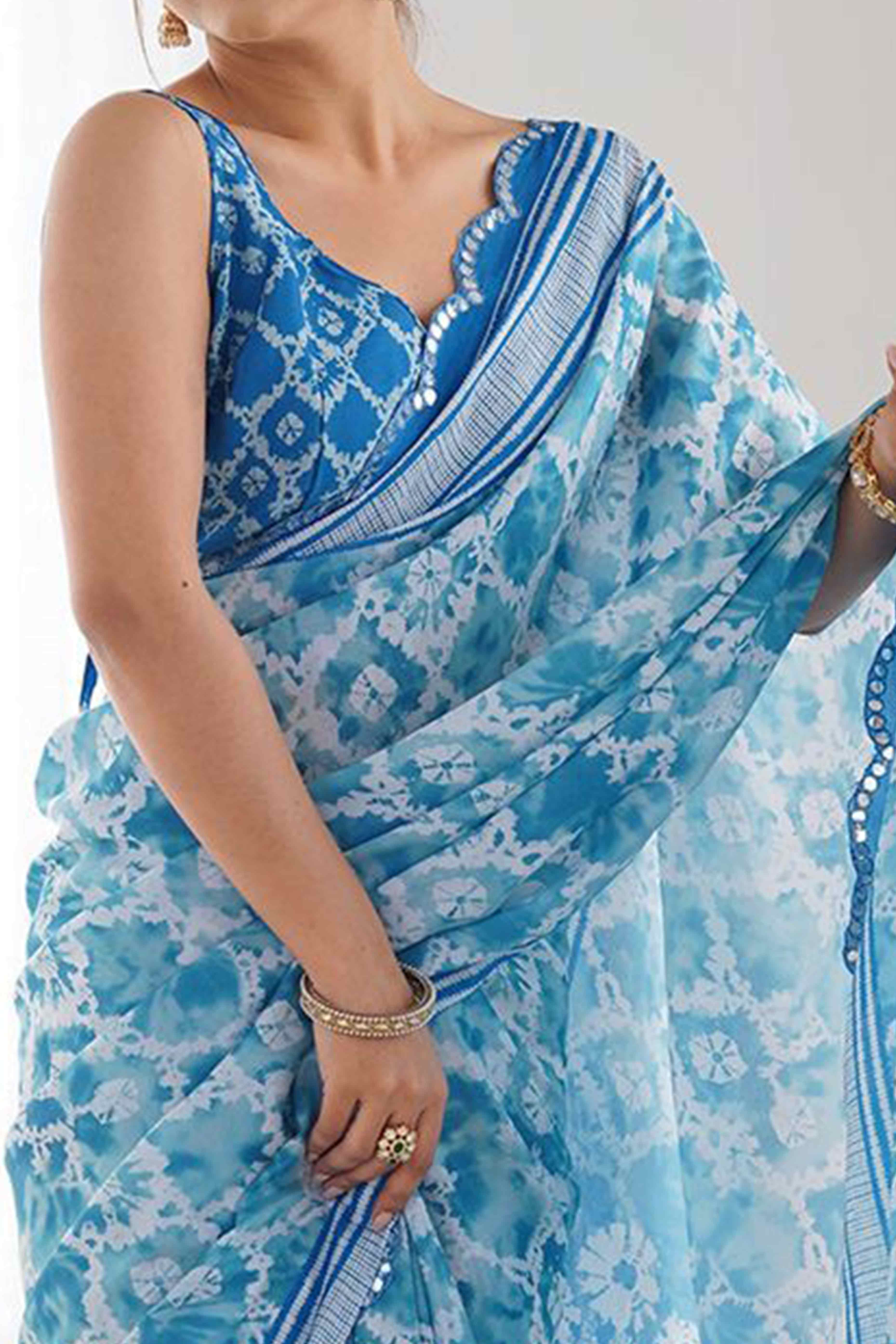 Sky Blue Digital Print Georgette Saree Enhanced With A Sparkling Lace Border