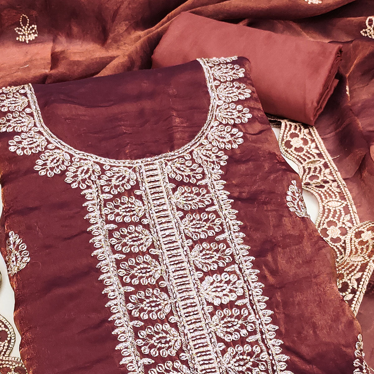 Rust Satin Dress Material Adorned With Elegant Floral Zari Embroidery & Intricate Handwork
