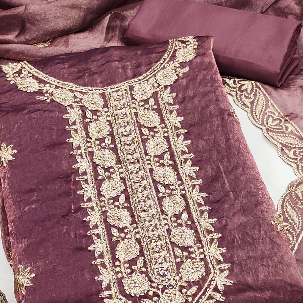 Purple Satin Dress Material Featuring Exquisite Floral Embroidery With Detailed Handwork Accents
