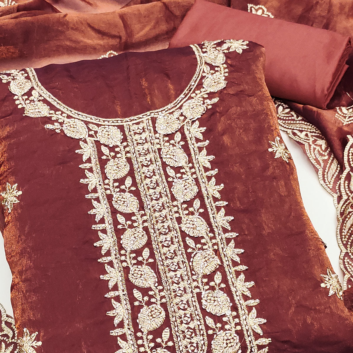 Rust Satin Dress Material Featuring Exquisite Floral Embroidery With Detailed Handwork Accents