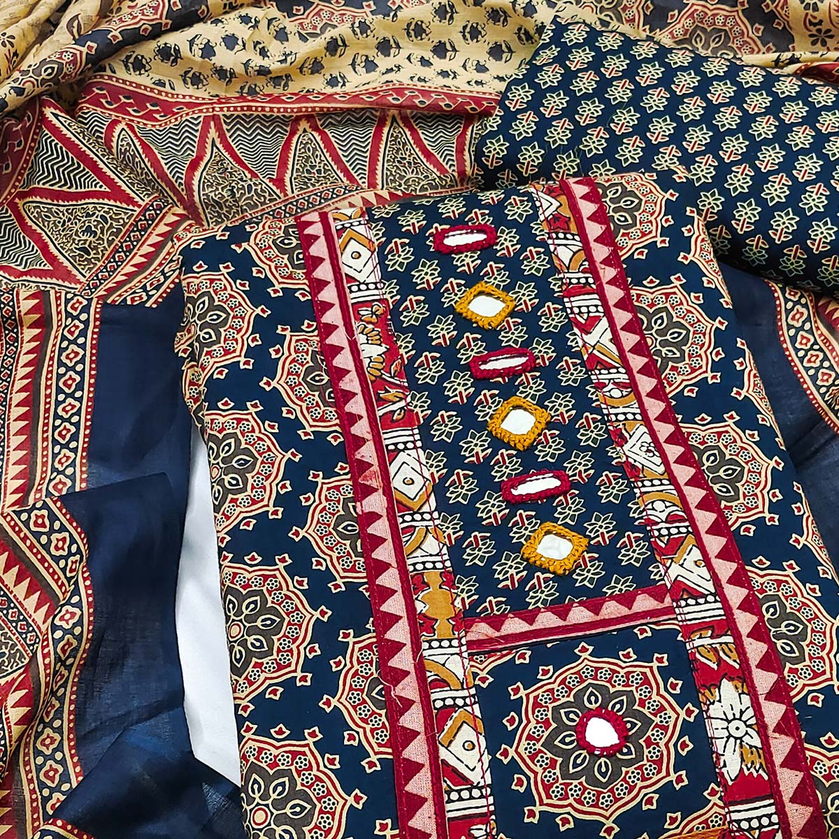 Ethnic Navy Blue Floral Printed Pure Cotton Dress Material Accented With Fine Neck Embroidery Work