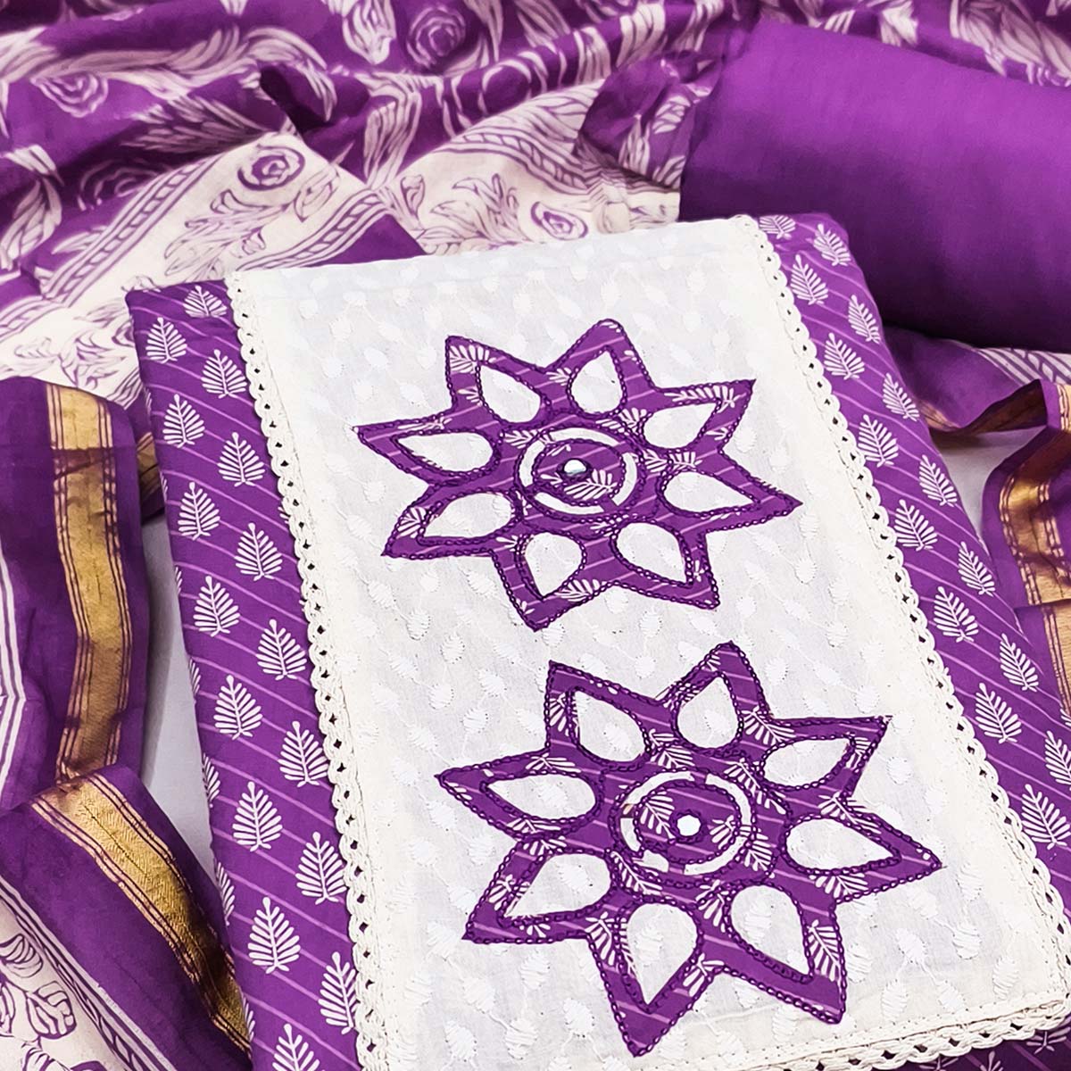 Purple Leaf & Striped Printed Pure Cotton Dress Material Accented With Floral Embroidered Neckline