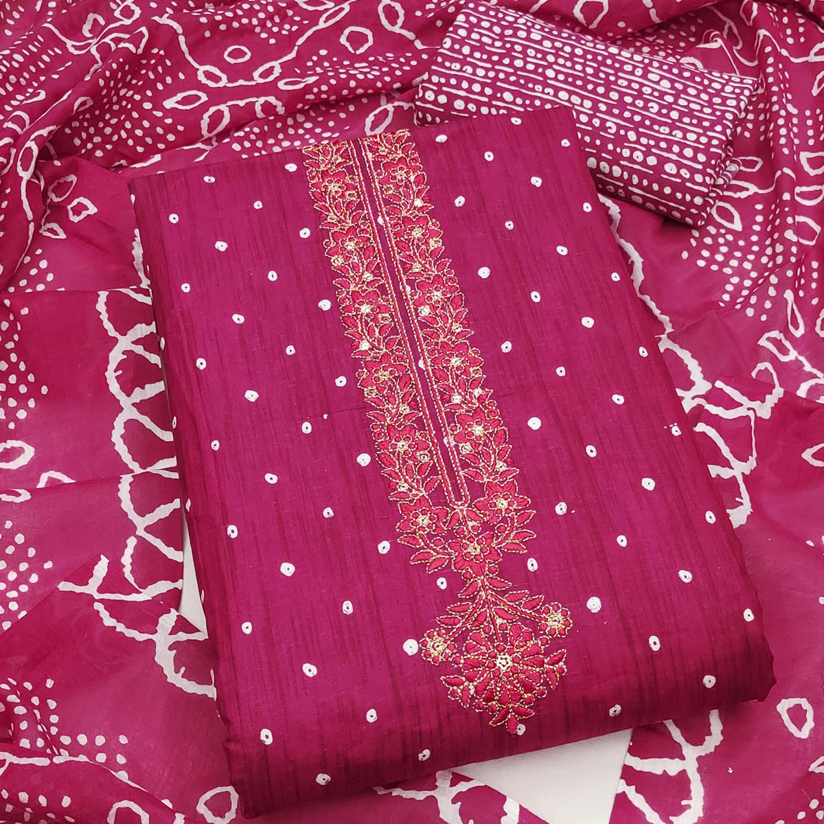 Rani Pink Pure Cotton Dress Material Showcasing Floral & Bandhani Prints With Neck Embroidery
