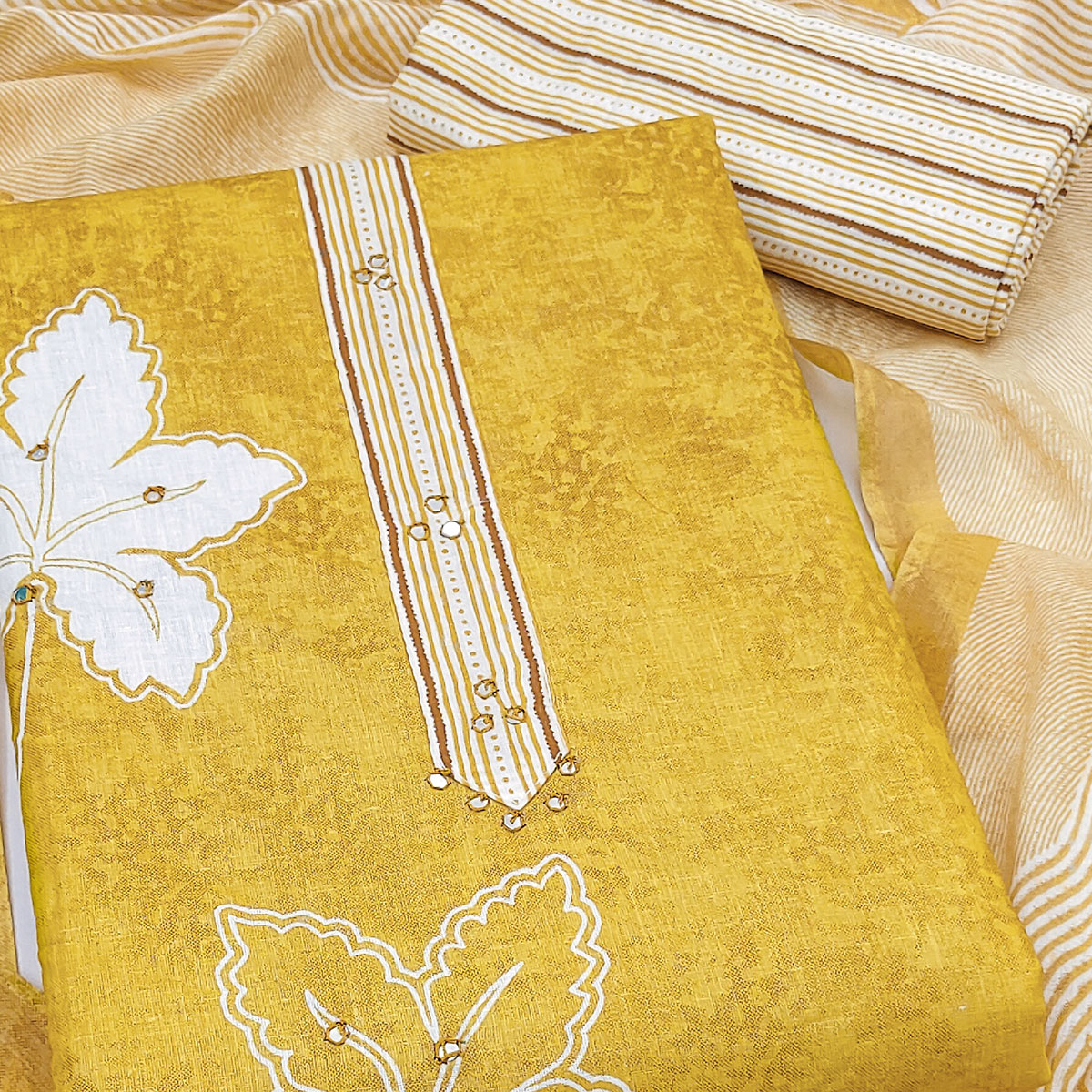 Charming Mustard Floral & Leaf Printed Pure Cotton Dress Material Featuring Subtle Embroidery Work