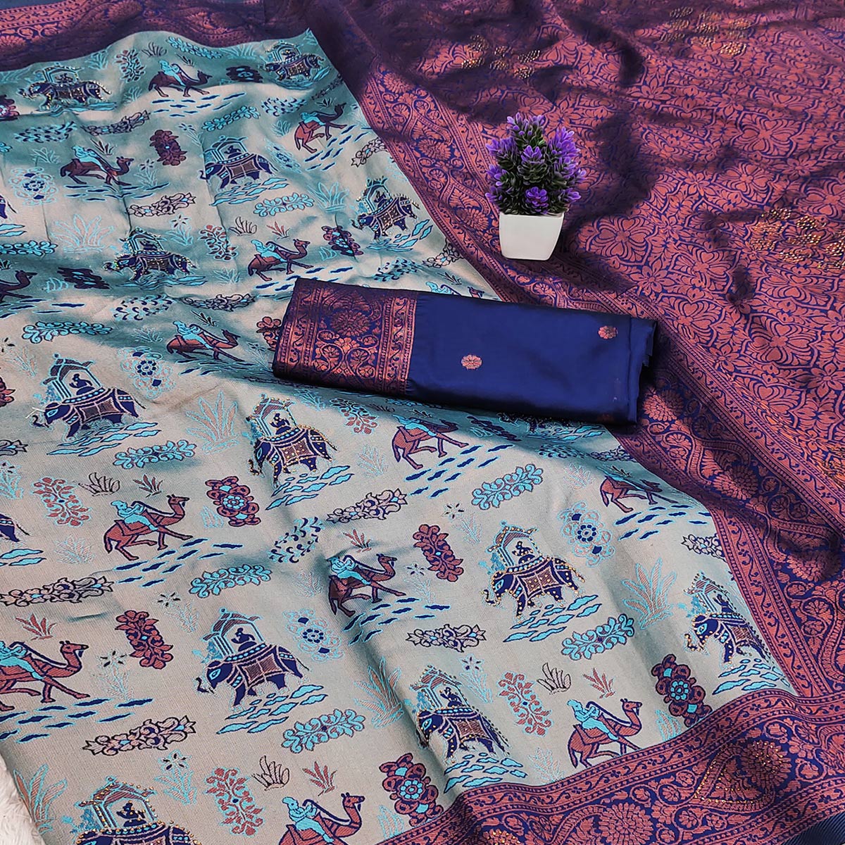 Greyish Blue & Royal Blue Tissue Silk Saree Highlighted with Artistic Weaving & Swarovski Sparkle