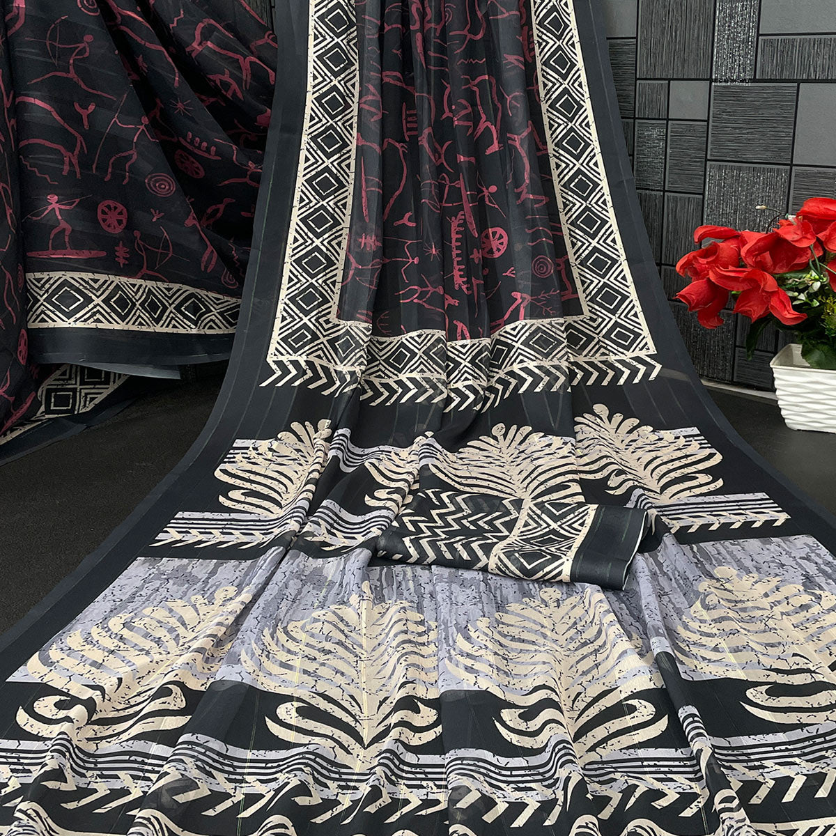 Charming Black Digital Printed Georgette Saree Accentuated With Zari Stripes