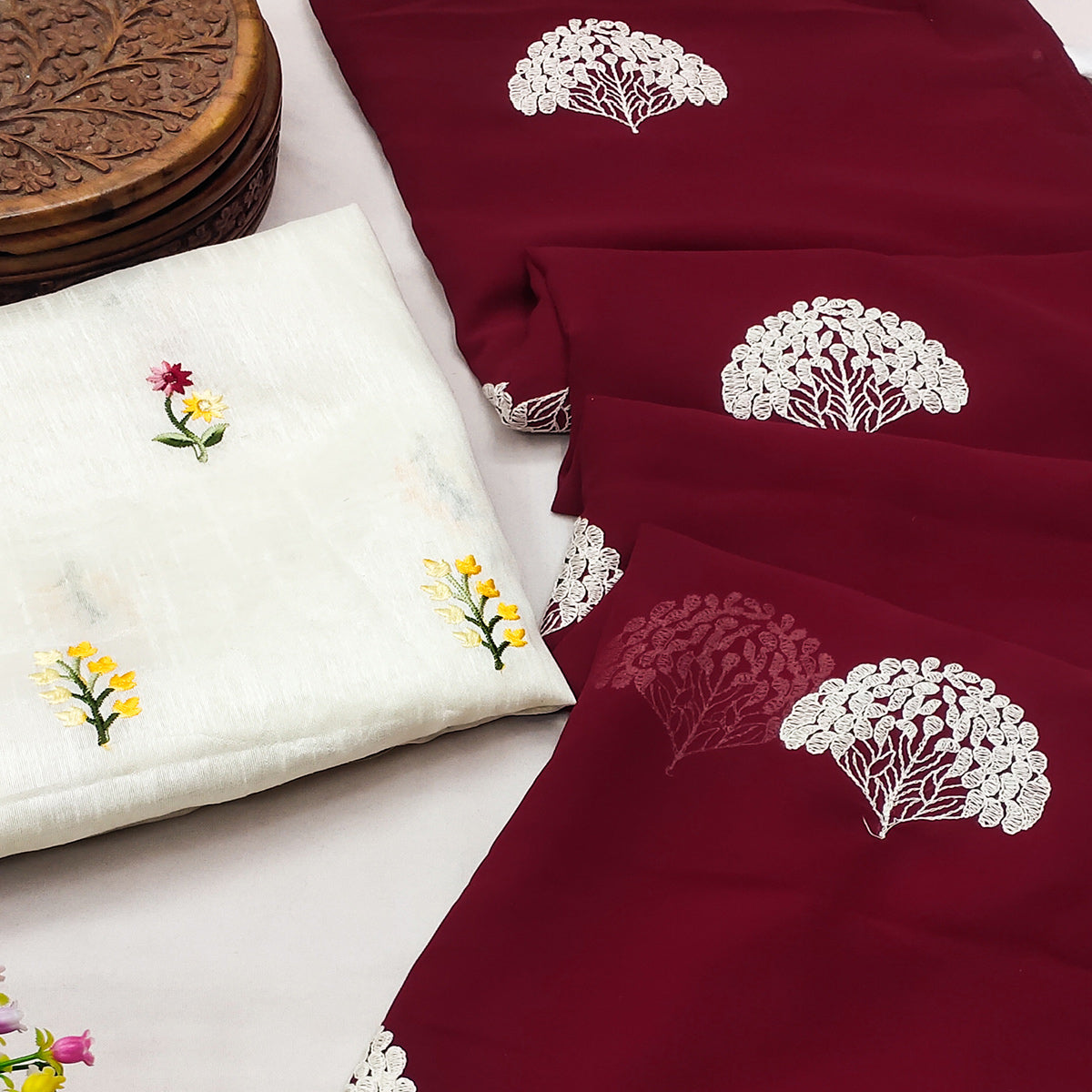 Maroon Thread Embroidered Georgette Saree With Tassels