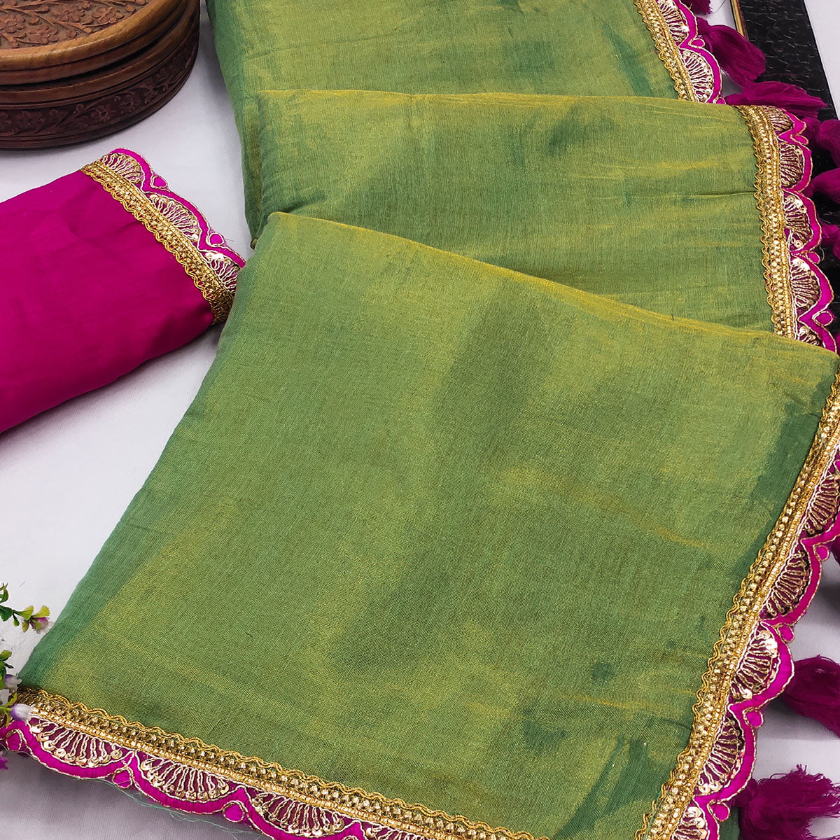 Green Beige Solid Tissue Saree Enhanced With Graceful Embroidered Lace Border Work
